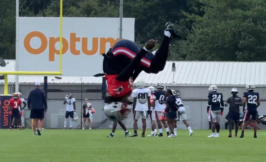 Patriots rookie QB Joe Milton does a backflip during training camp