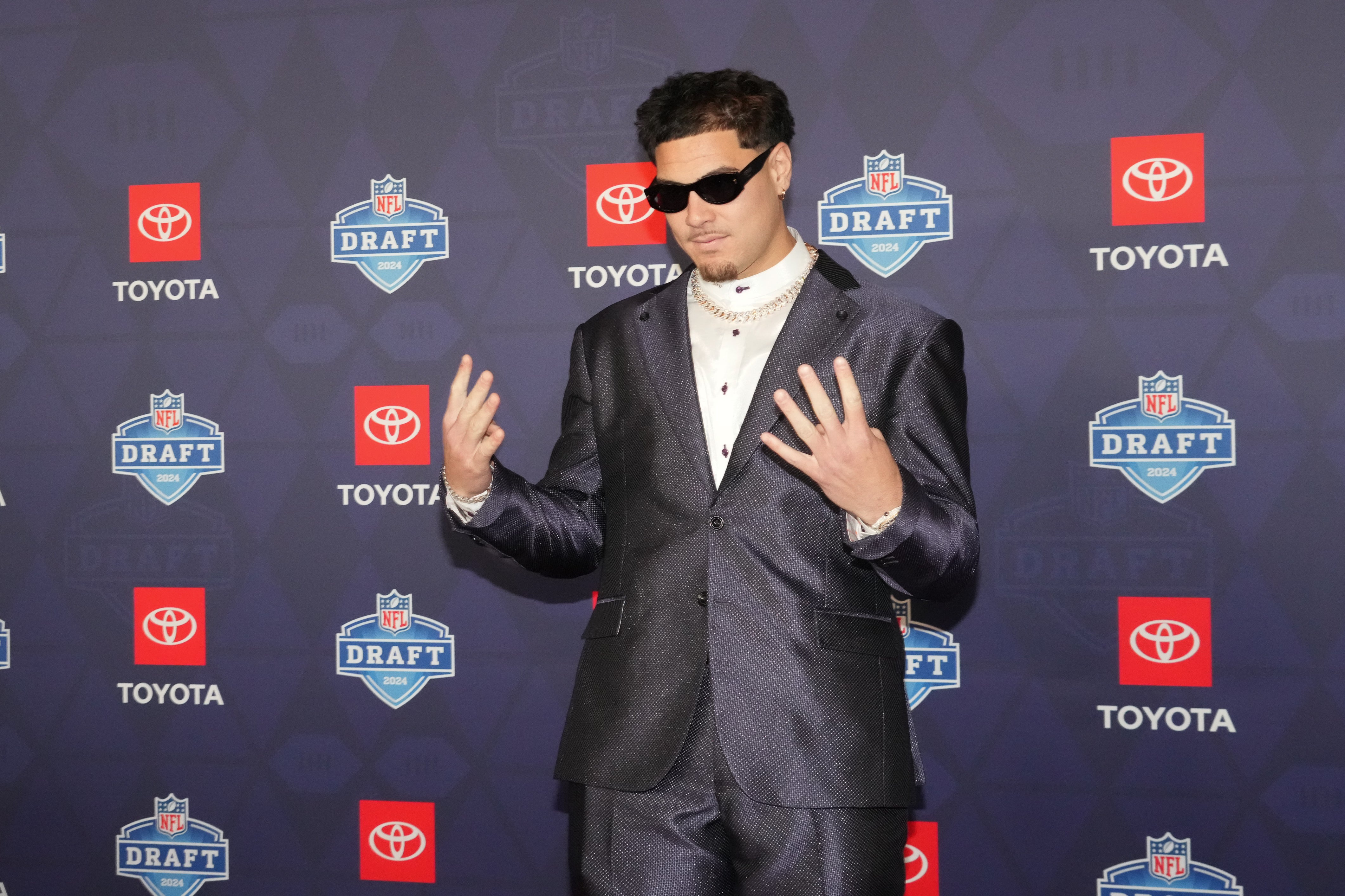 Apr 25, 2024; Detroit, MI, USA; UCLA Bruins defensive lineman Laiatu Latu stands on the red carpet ahead of the 2024 NFL Draft at Detroit’s Fox Theatre.