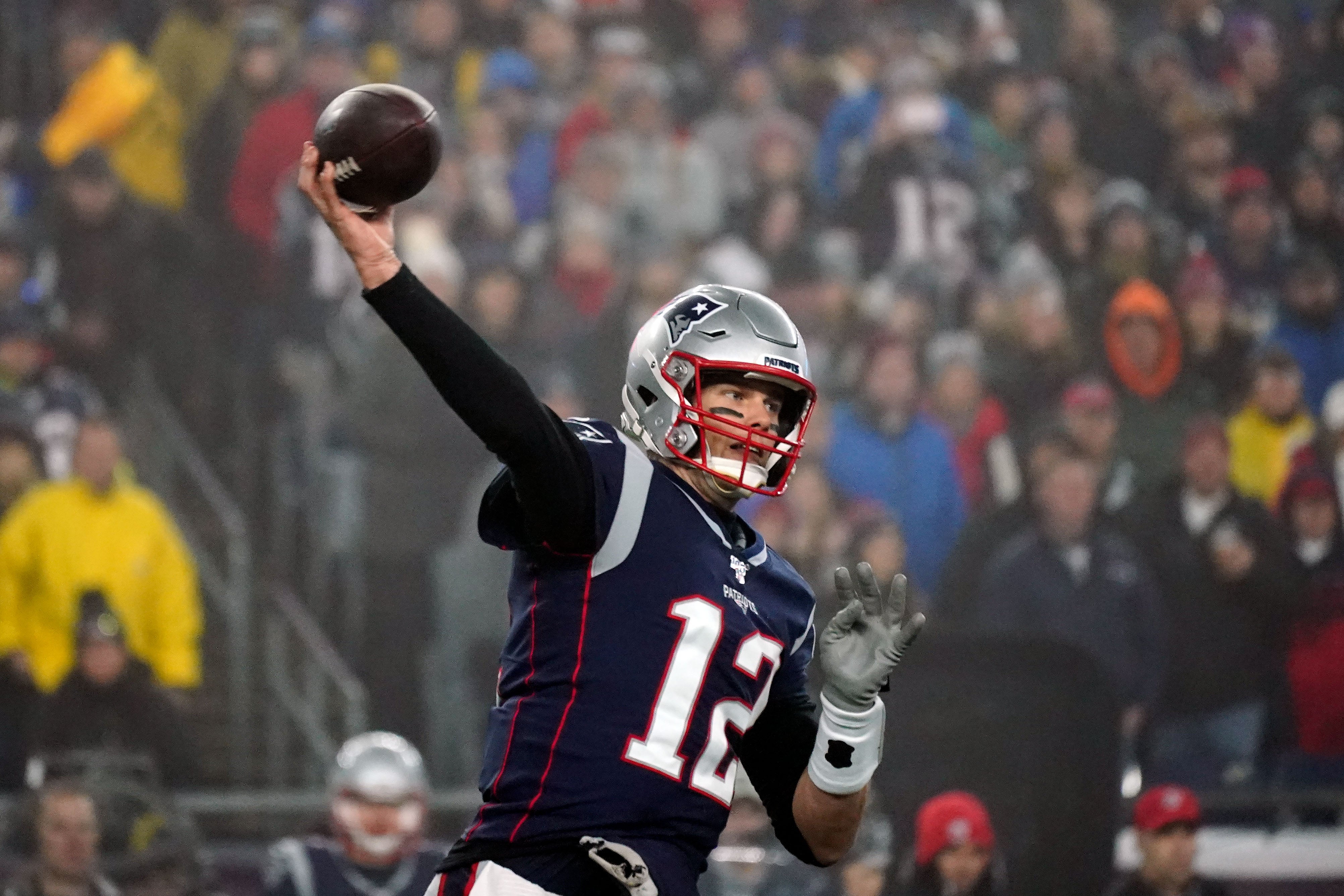 Jan 4, 2020; Foxborough, Massachusetts, USA; New England Patriots quarterback Tom Brady (12) throws the ball against the Tennessee Titans during the second quarter at Gillette Stadium.