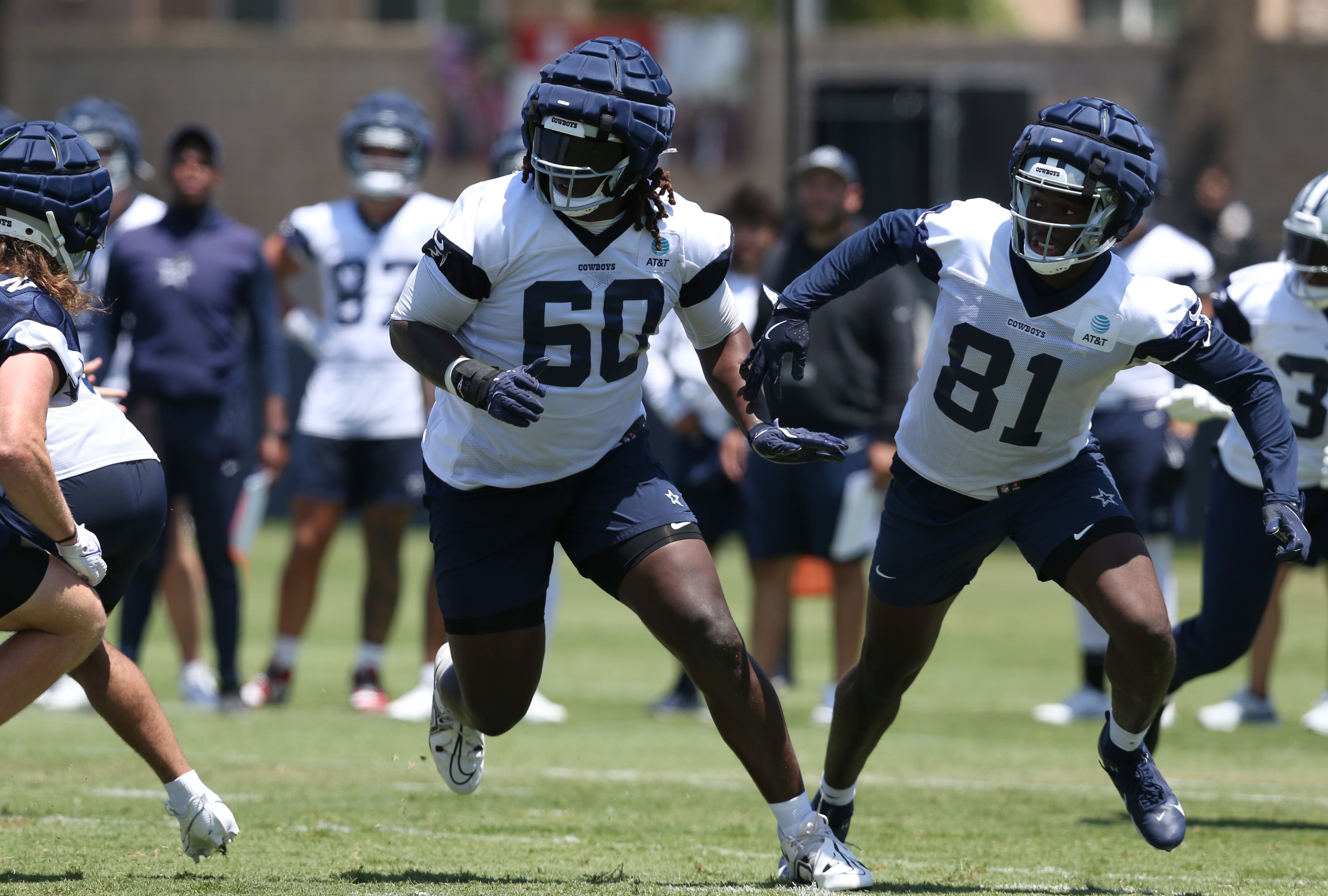 Dallas Cowboys tackle Tyler Guyton (60) and tight end John Stephens (81) during training camp at the River Ridge Playing Fields in Oxnard, Californian.