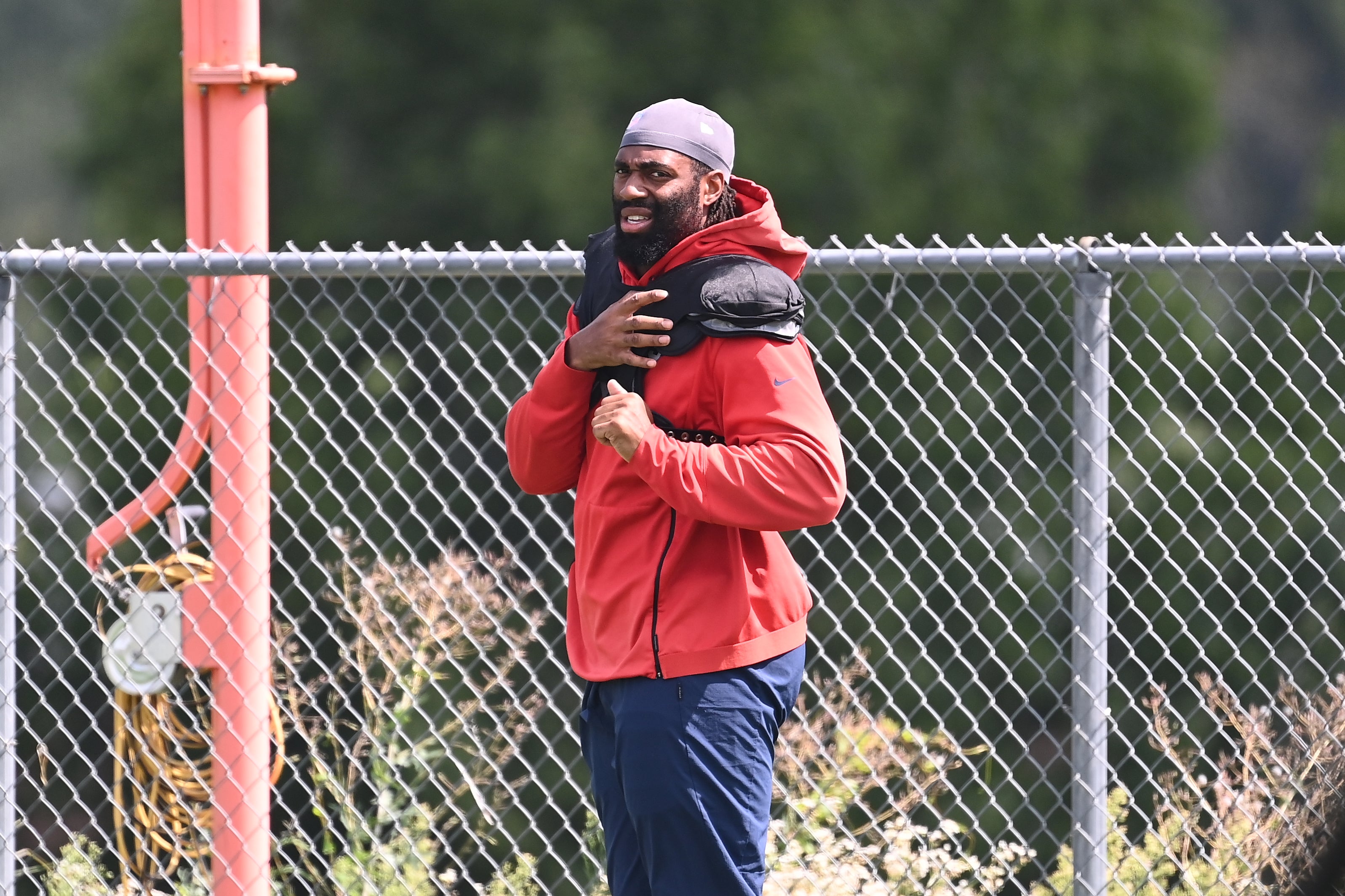Aug 03, 2024; Foxborough, MA, USA; New England Patriots linebacker Matthew Judon (9) puts on his pads at training camp at Gillette Stadium