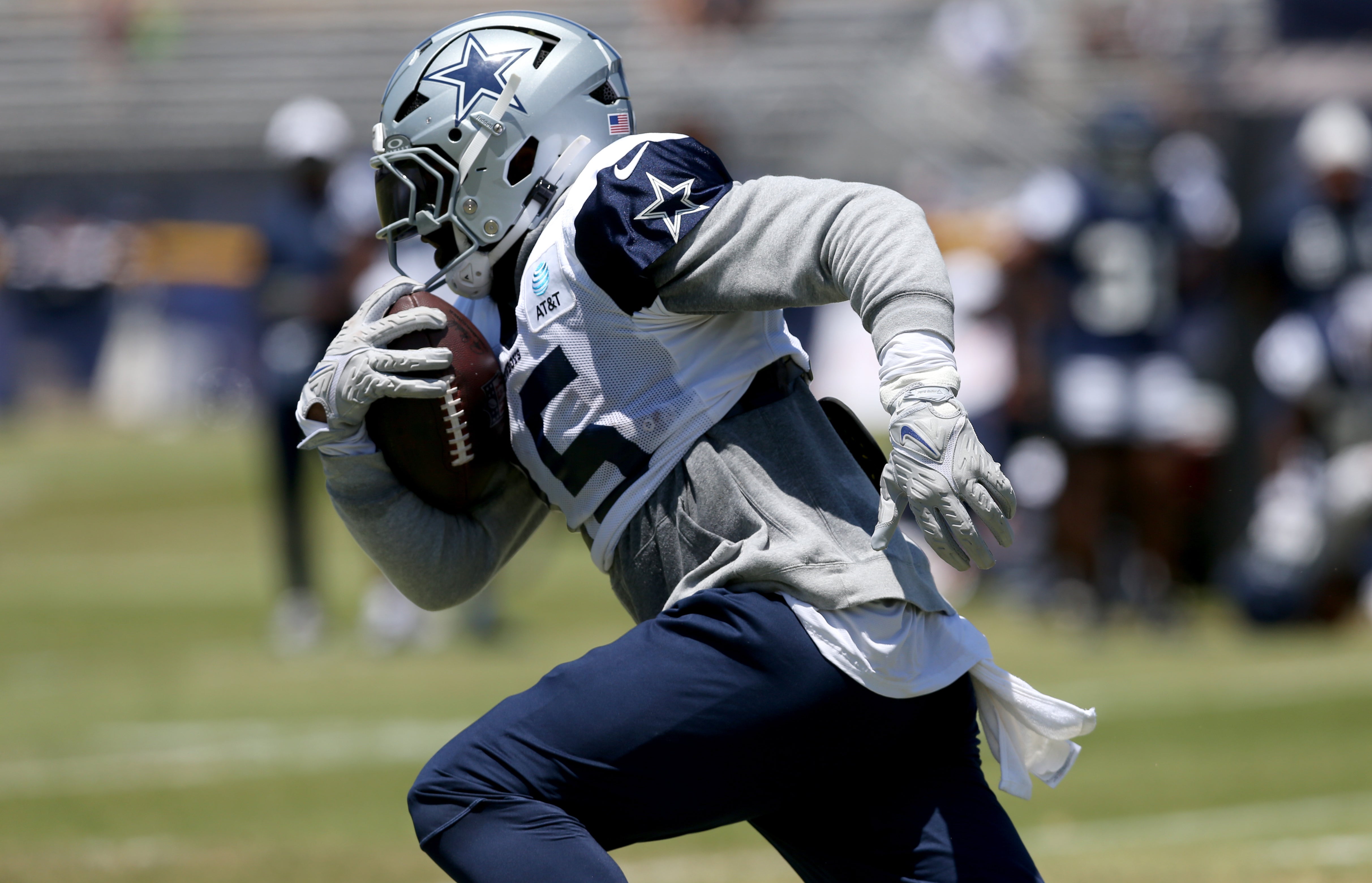 Dallas Cowboys running back Ezekiel Elliott (15) runs during training camp at the River Ridge Playing Fields in Oxnard, California.