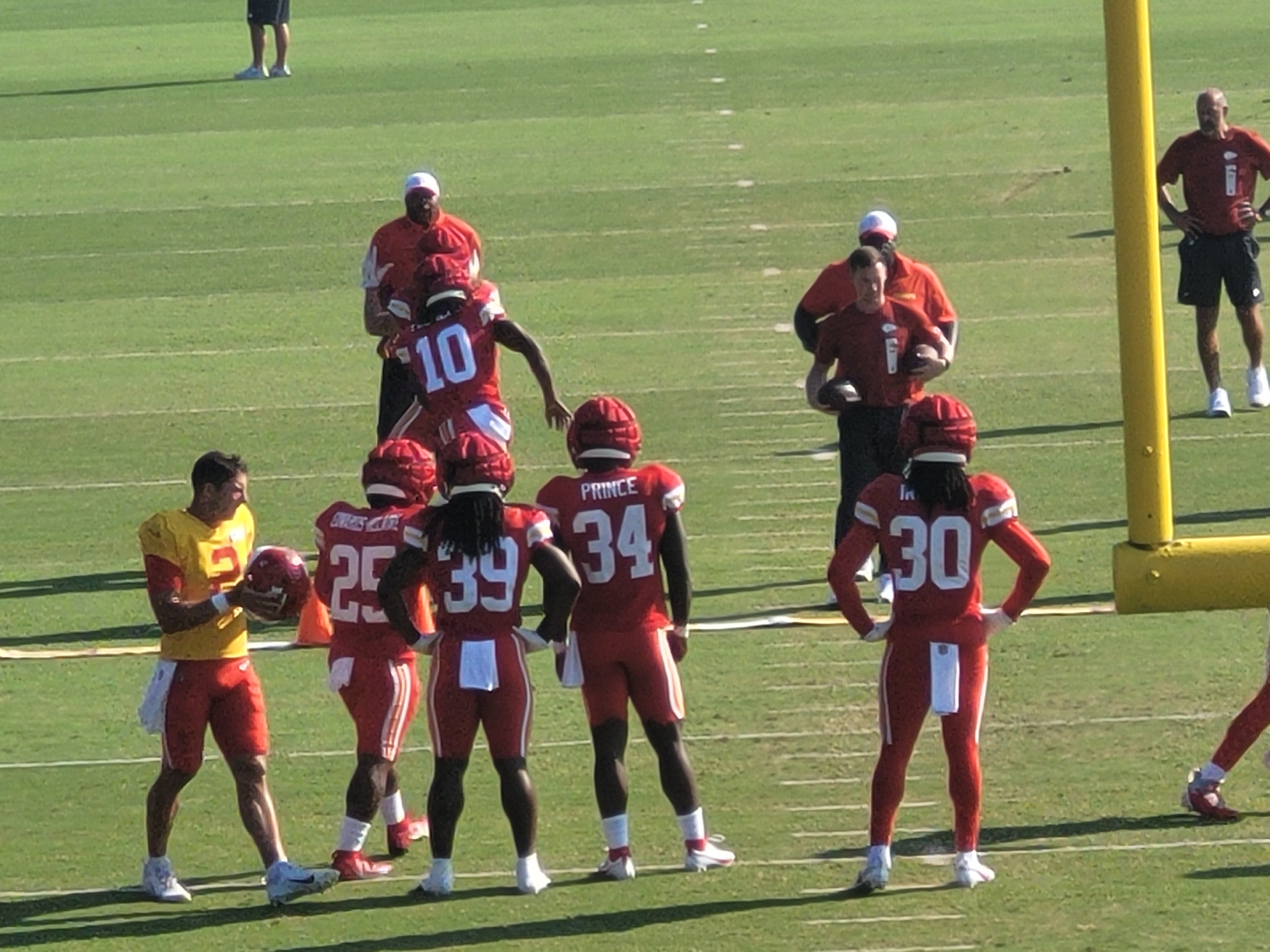 Chiefs RBs work on a drill at training camp.