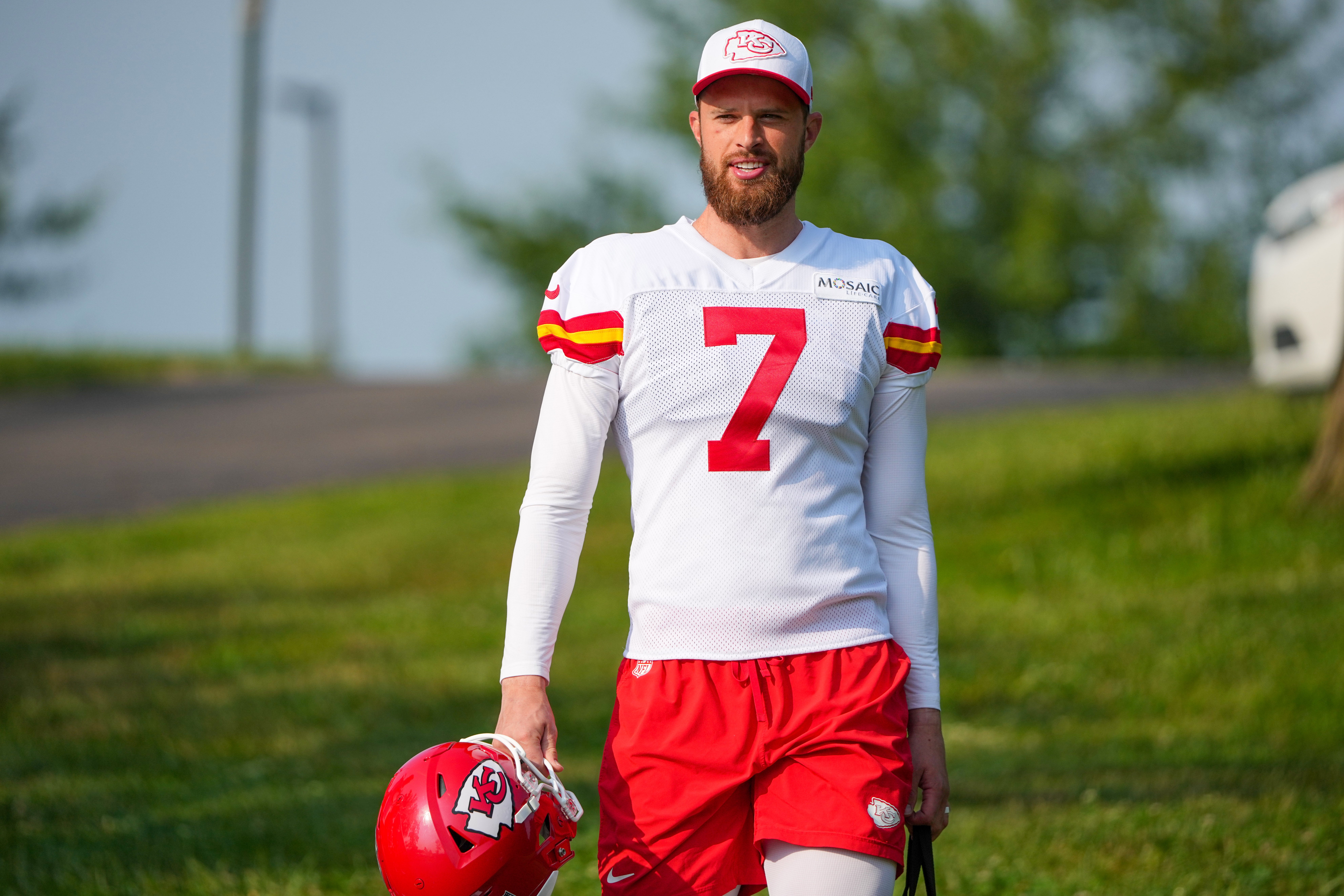 Jul 22, 2024; St. Joseph, MO, USA; Kansas City Chiefs kicker Harrison Butker (7) walks down the hill from the locker room to the fields prior to training camp at Missouri Western State University.