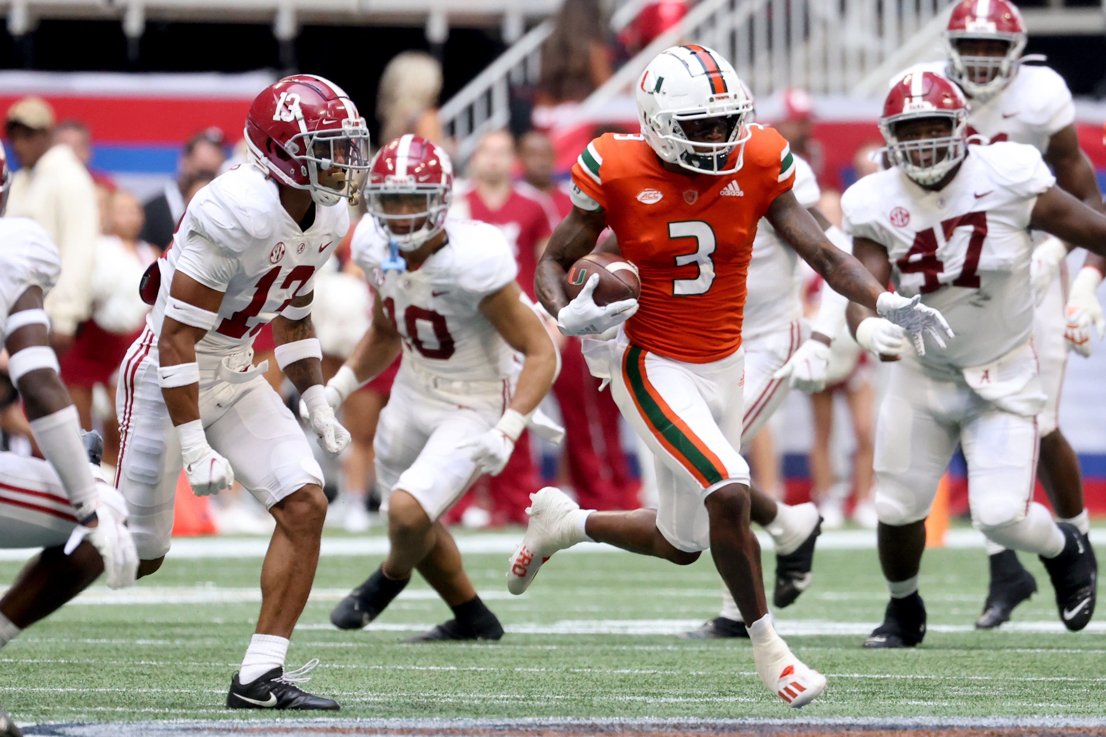Sep 4, 2021; Atlanta, Georgia, USA; Miami Hurricanes wide receiver Mike Harley (3) runs after a catch against Alabama Crimson Tide defensive back Malachi Moore (13) during the third quarter at Mercedes-Benz Stadium.