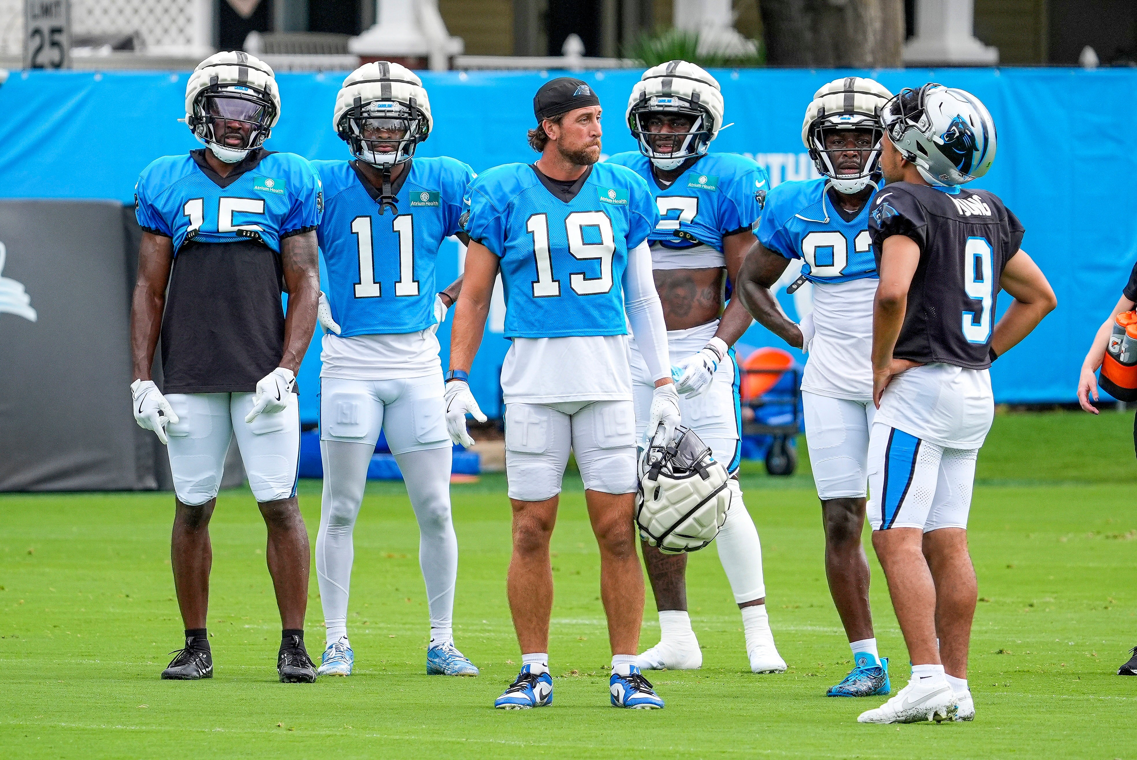 Jul 30, 2024; Charlotte, NC, USA; Carolina Panthers wide receiver Jonathan Mingo (15), wide receiver Ihmir Smith-Marsette (11), wide receiver Adam Thielen (19), wide receiver Deven Thompkins (12), wide receiver David Moore (83) and quarterback Bryce Young (9) during training camp at Carolina Panthers Practice Fields. Mandatory Credit: Jim Dedmon-USA TODAY Sports