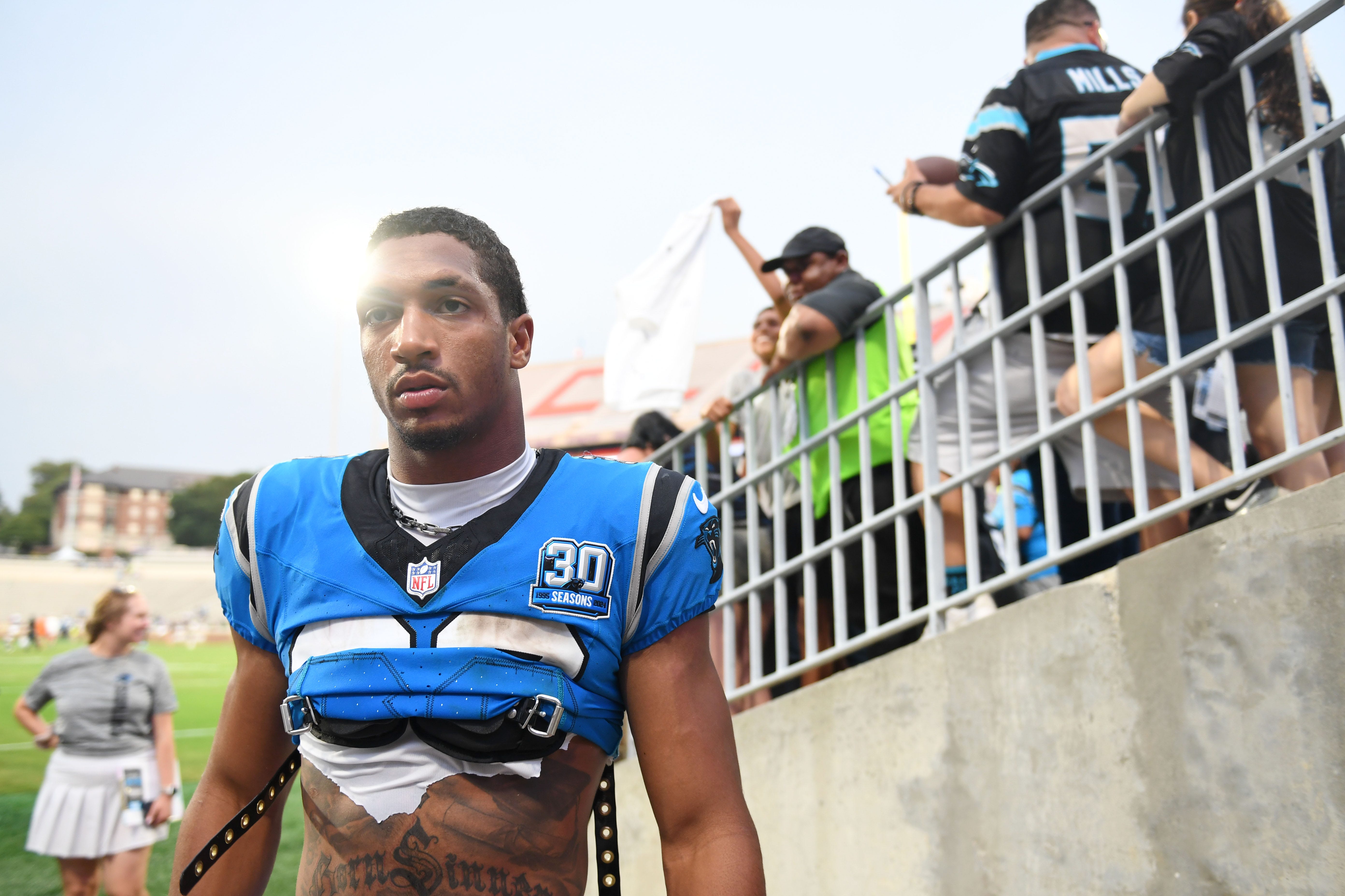 Carolina Panthers running back , Chuba Hubbard (30), walks off the field at Memorial Stadium during the Panthers Fan Fest in Clemson, S.C., on Thursday, Aug. 1, 2024.
