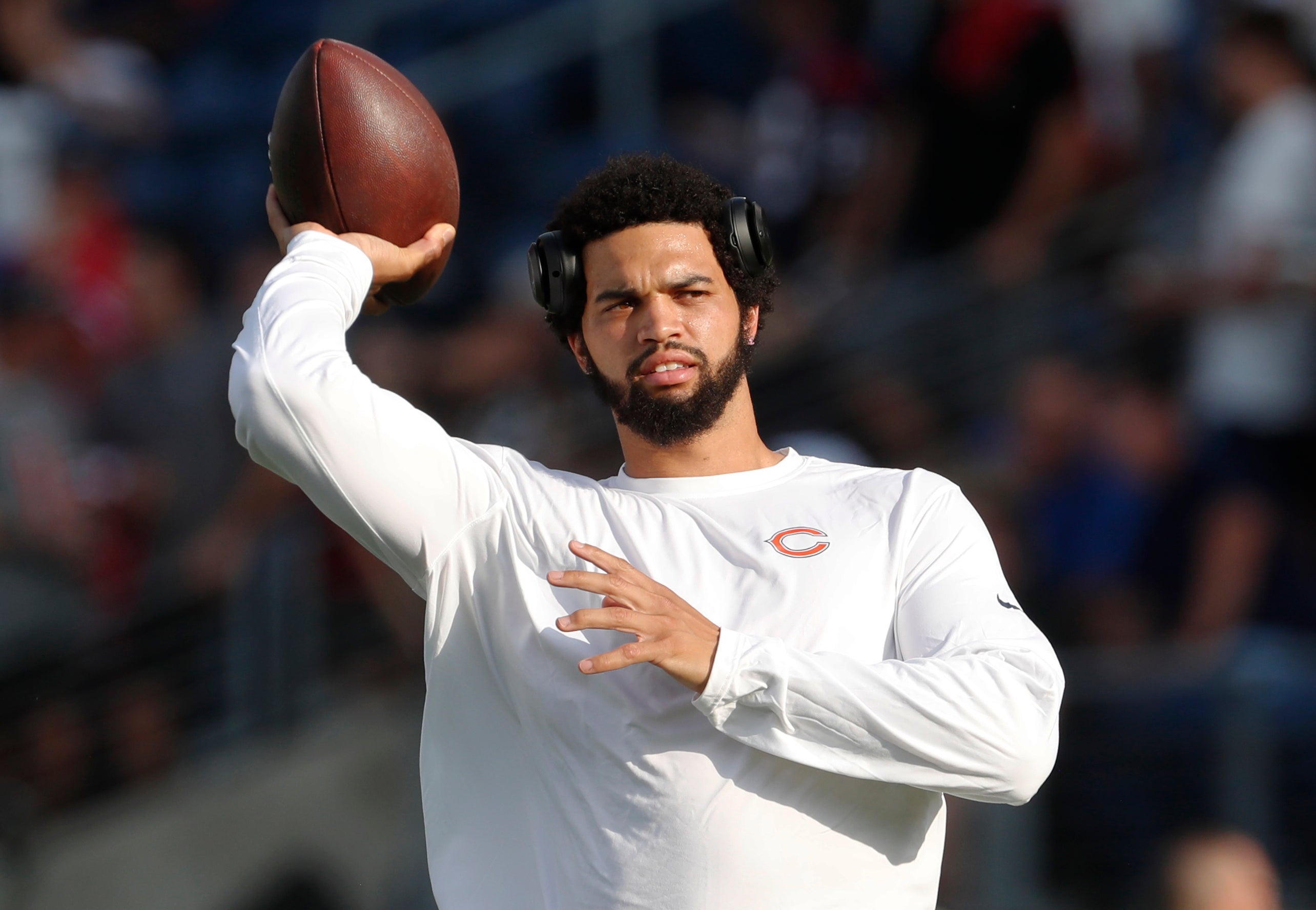 Aug 1, 2024; Canton, Ohio, USA; Chicago Bears quarterback Caleb Williams (18) warms up before the game against the Houston Texans at Tom Benson Hall of Fame Stadium.
