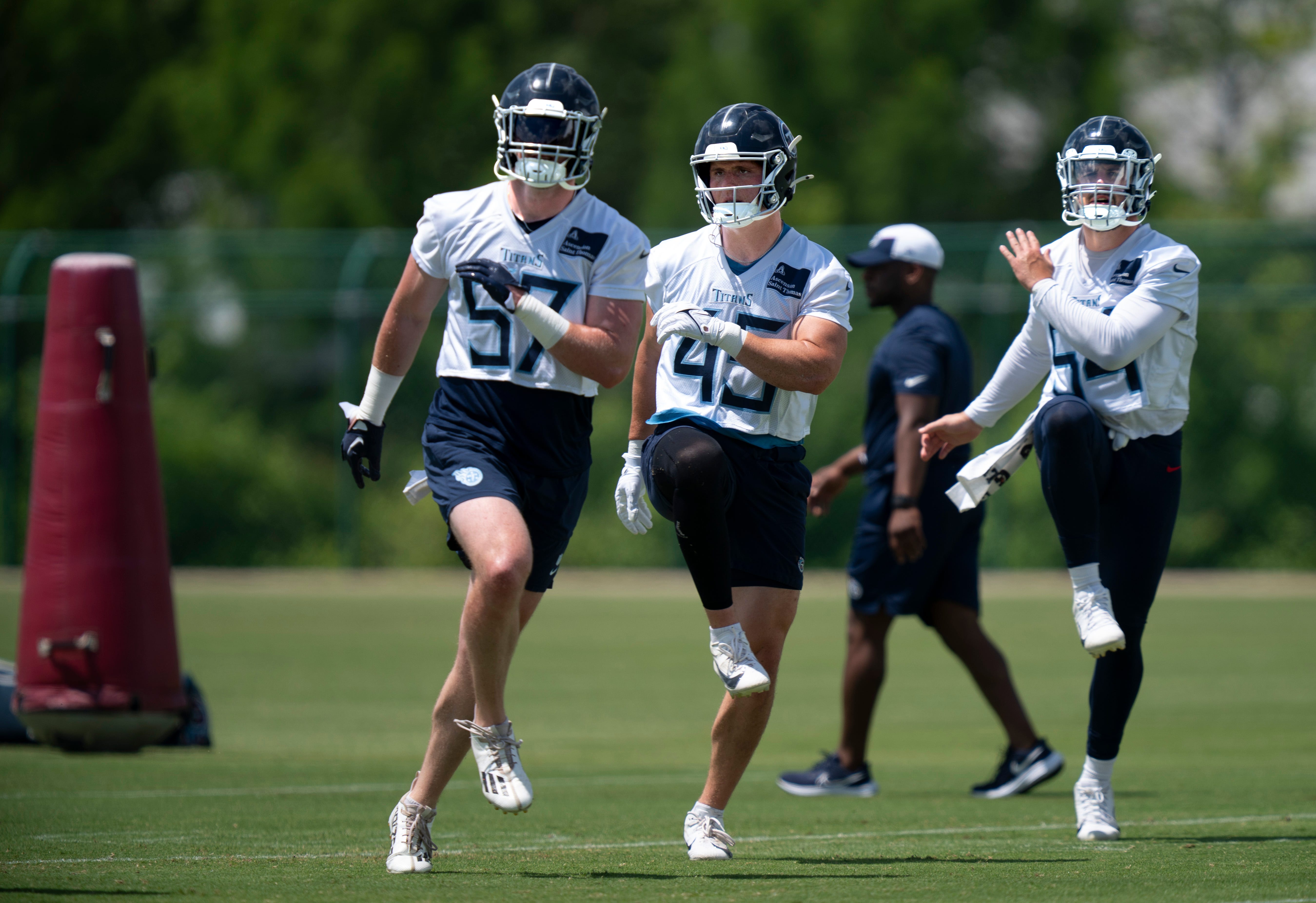 Linebackers, from left, Luke Gifford (57), Chance Campbell (45) and Garret Wallow (54) go through warmup drills during the Tennessee Titans mandatory mini-camp at Ascension Saint Thomas Sports Park in... Denny Simmons / The Tennessean-USA TODAY NETWORK