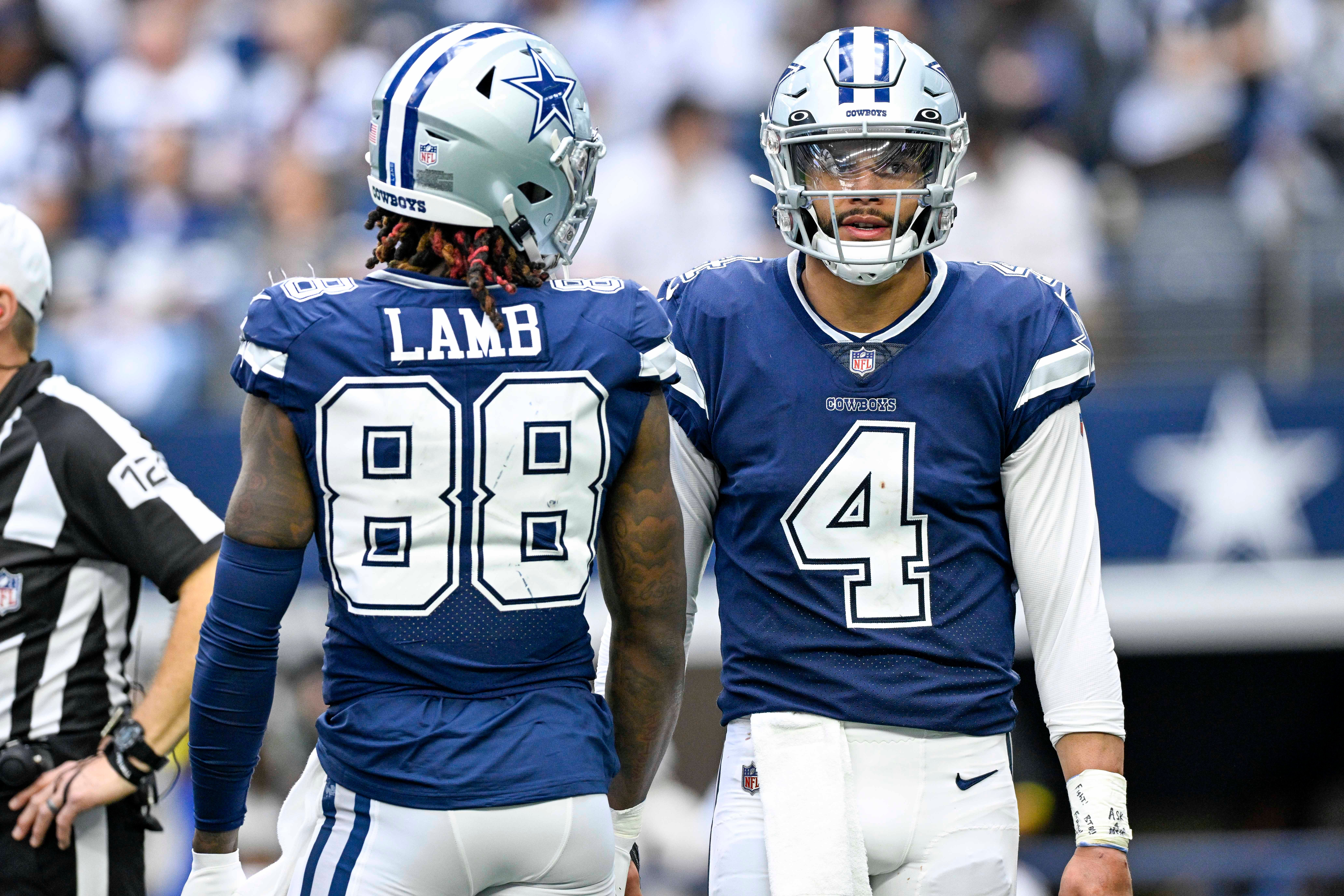 Dallas Cowboys quarterback Dak Prescott (4) and wide receiver CeeDee Lamb (88) during the game between the Dallas Cowboys and the Chicago Bears at AT&T Stadium.