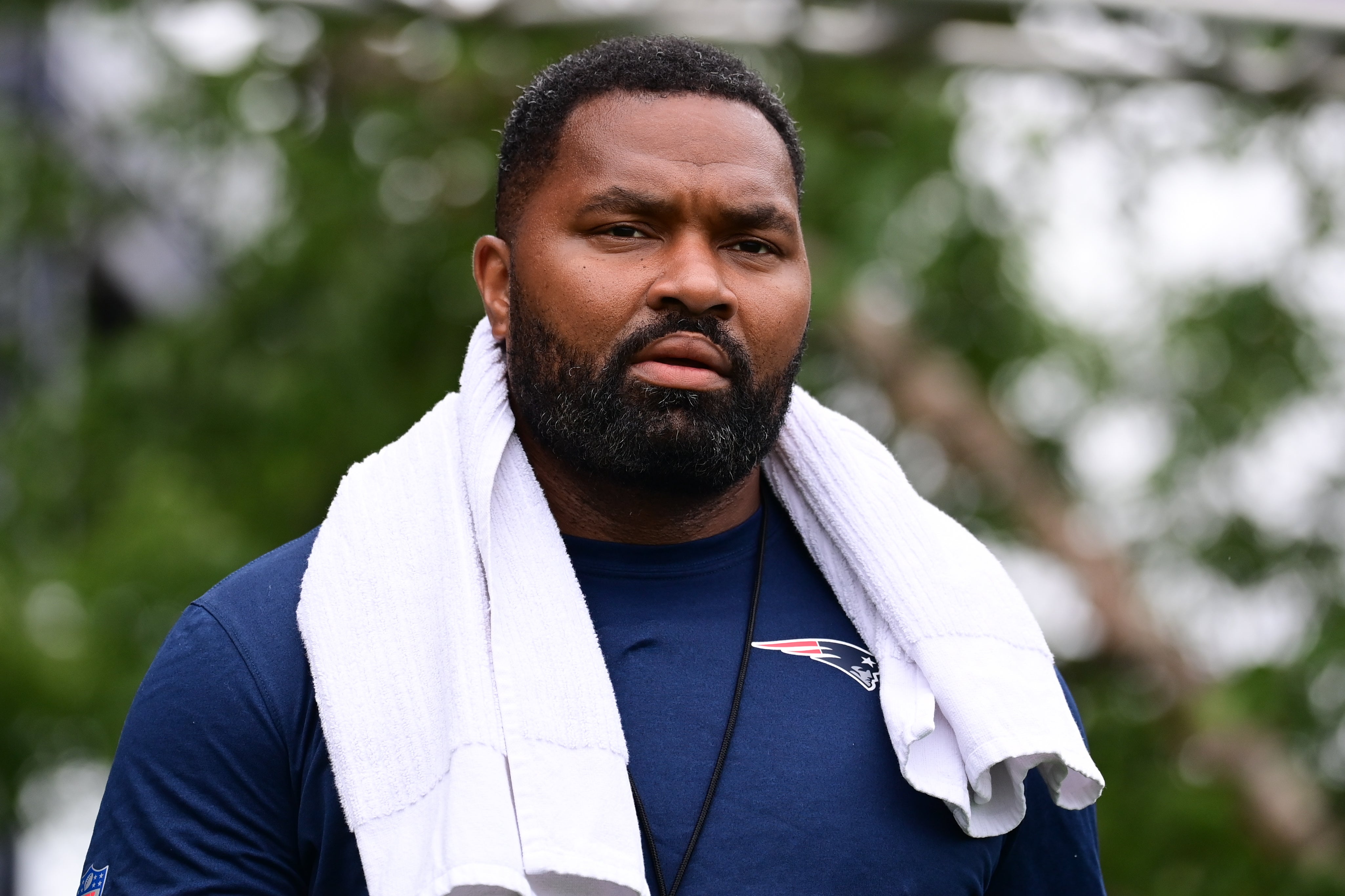 Jul 24, 2024; Foxborough, MA, USA; New England Patriots head coach Jerod Mayo walks to the podium for a press conference before training camp at Gillette Stadium.
