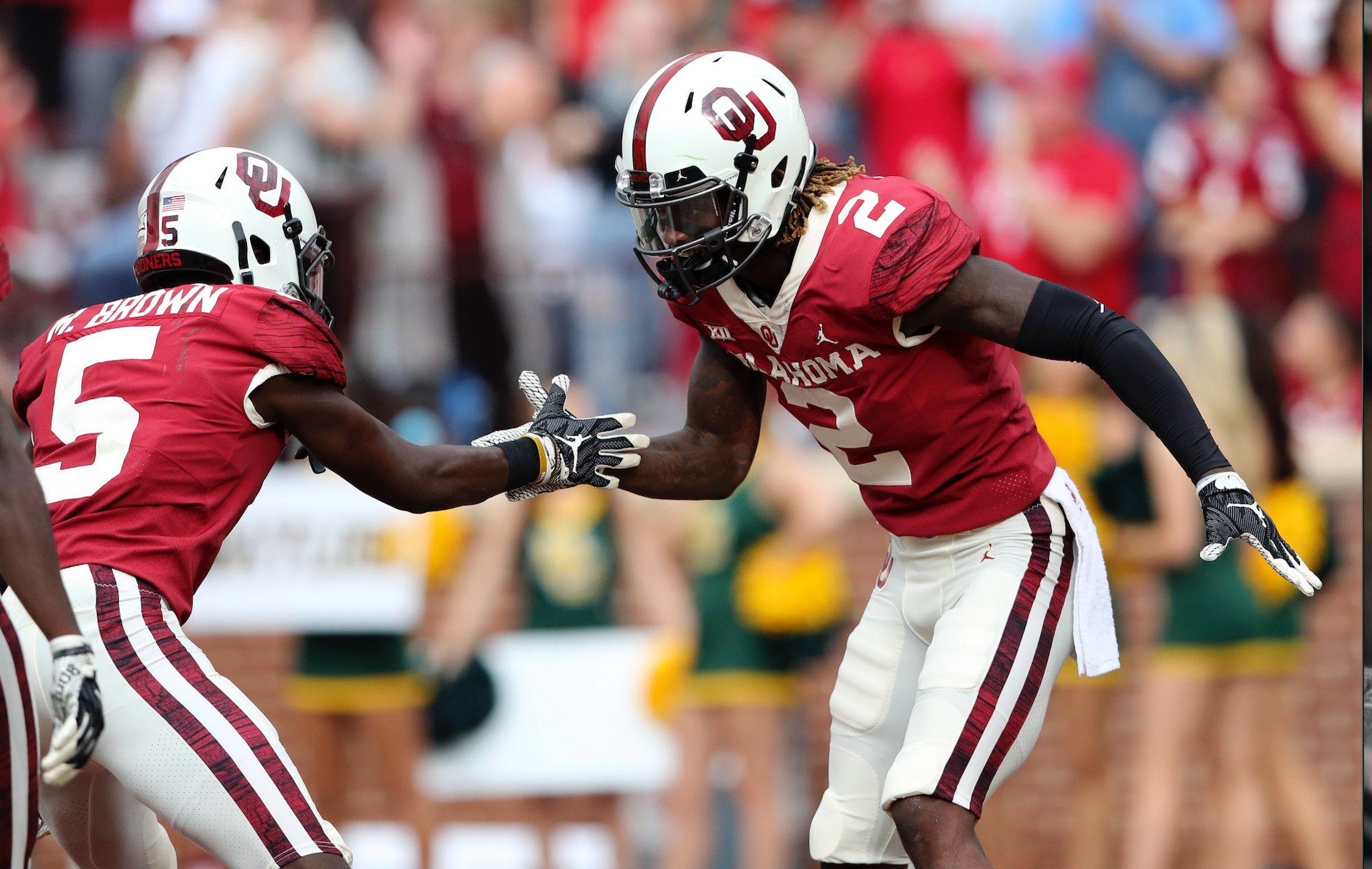 Oklahoma Sooners wide receiver CeeDee Lamb (2) celebrates with wide receiver Marquise Brown (5) after scoring a touchdown during the game against the Baylor Bears at Gaylord Family