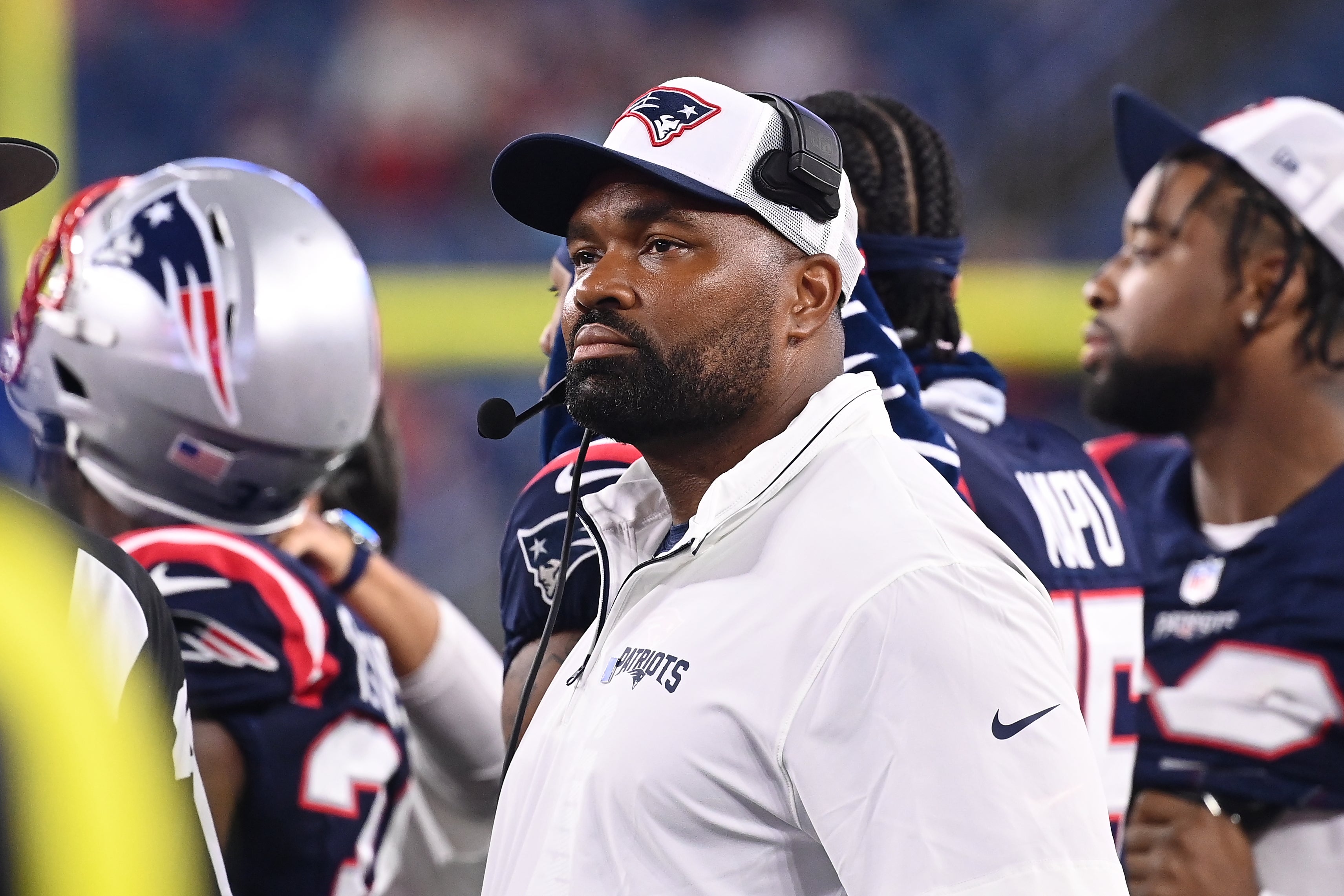 August 8, 2024; Foxborough, MA, USA; New England Patriots head coach Jerod Mayo watches the video boards after challenging a call on the field during the second half against the Carolina Panthers at Gillette Stadium.