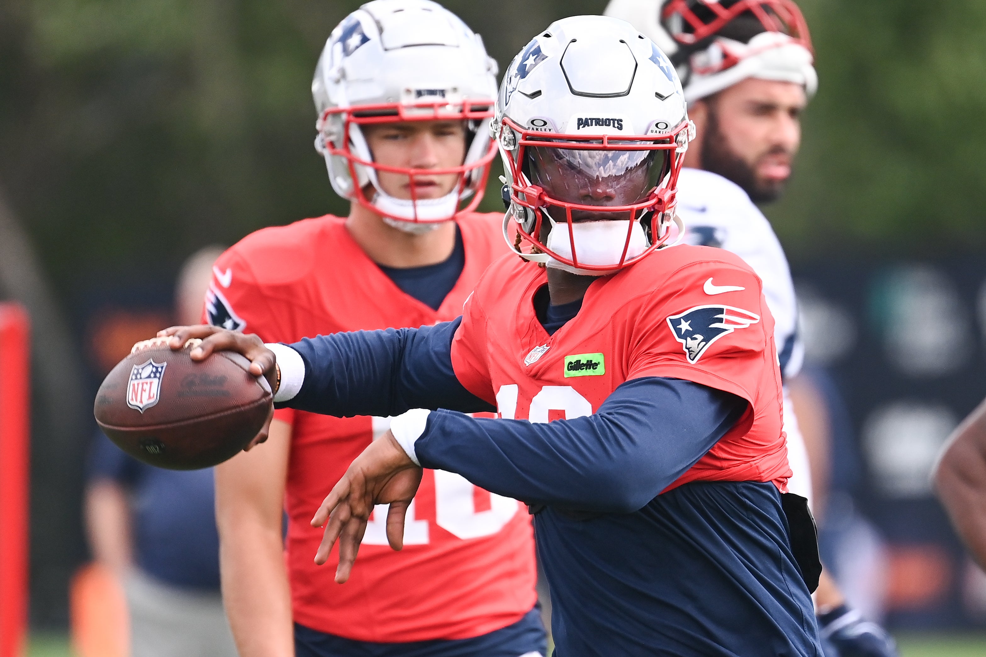 Aug 03, 2024; Foxborough, MA, USA; New England Patriots quarterback Joe Milton III (19) throws a pass during training camp at Gillette Stadium.