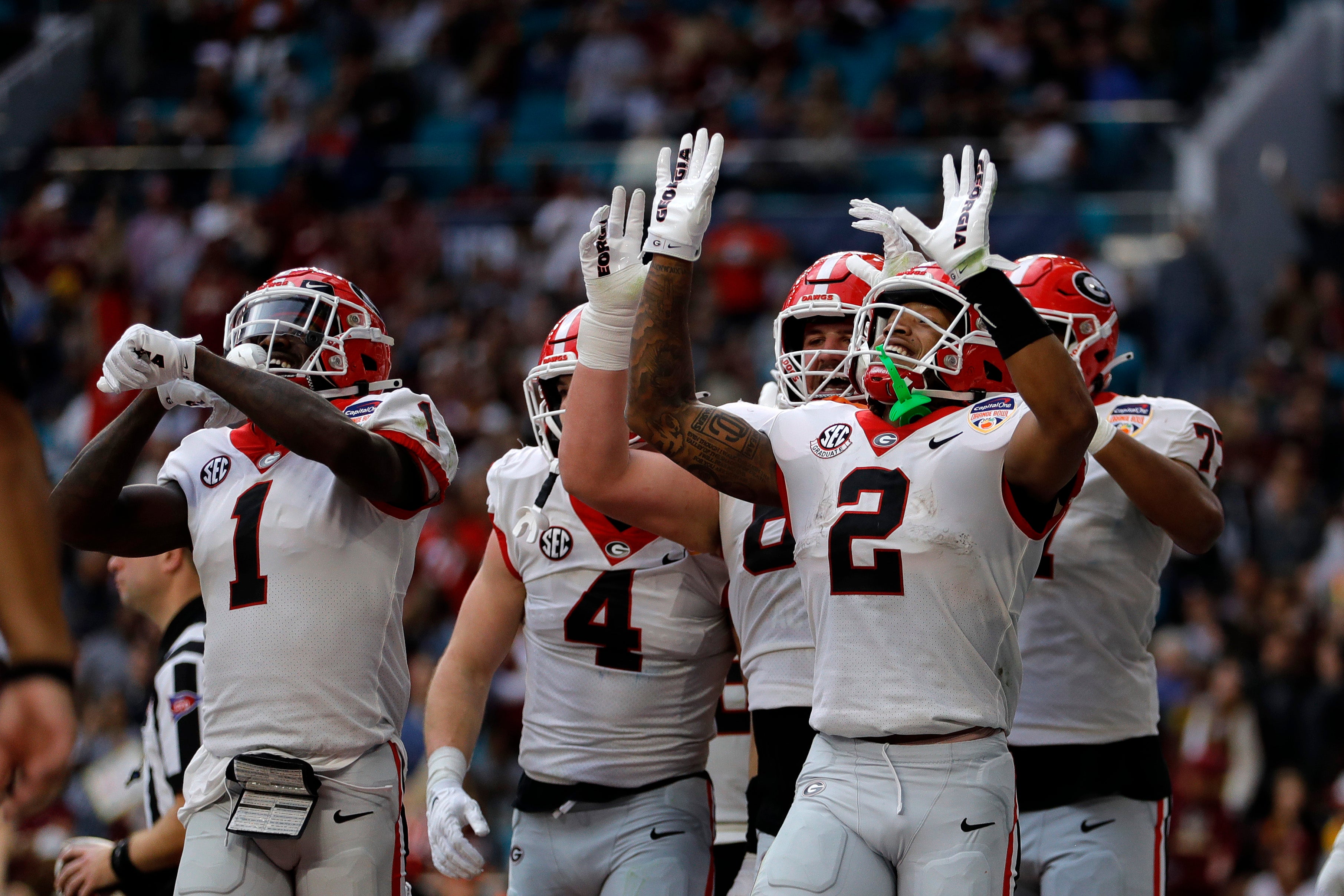 Kendall Milton celebrates a touchdown with teammates