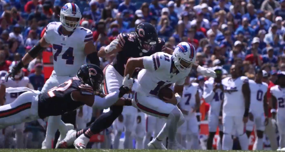 Austin Booker and Daniel Hardy sack Mitch Trubisky.