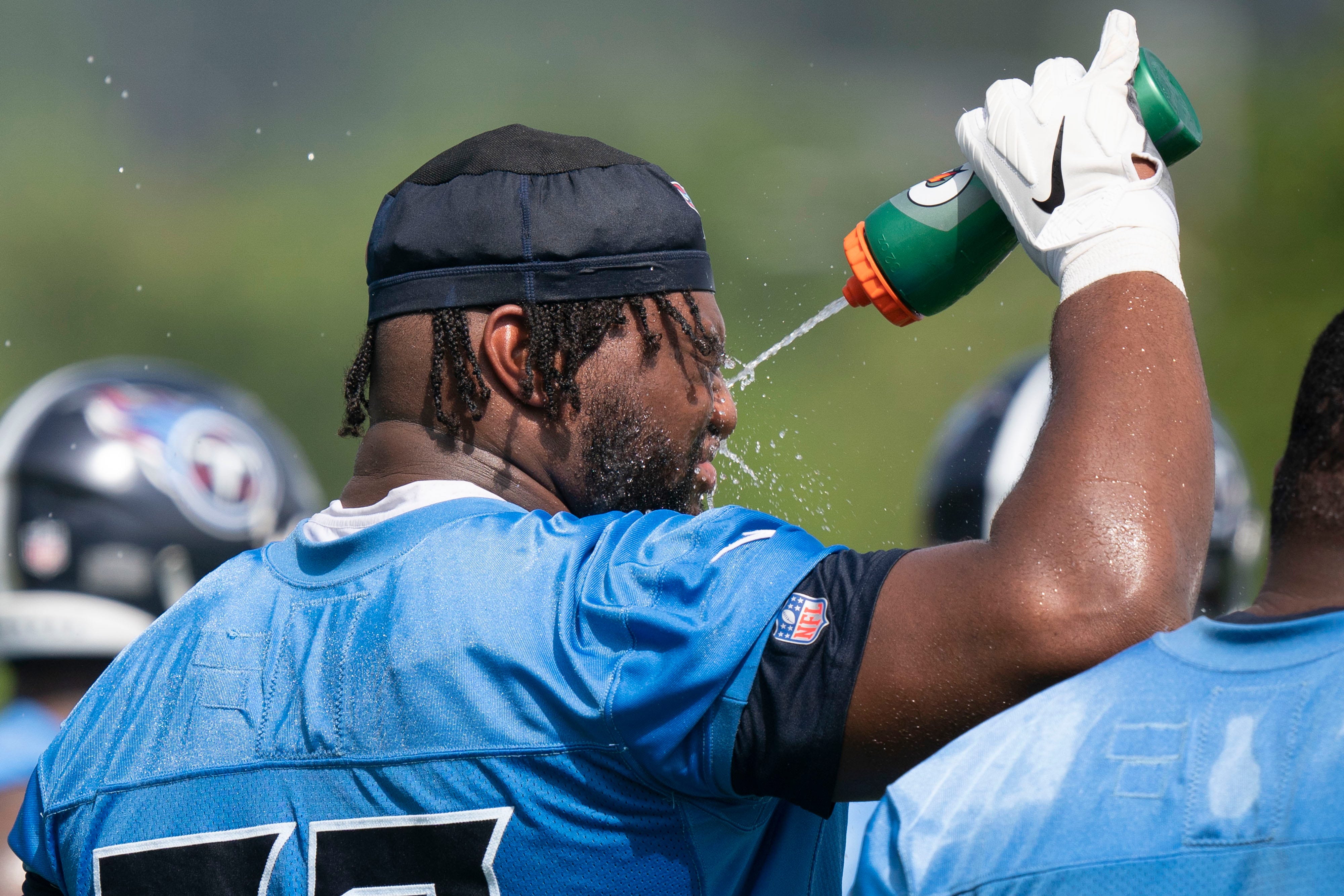 Tennessee Titans defensive end Jayden Peevy (72) cools off during practice at Saint Thomas Sports Park Tuesday, June 14, 2022, in Nashville, Tenn. Nas Titans Mini Camp 029