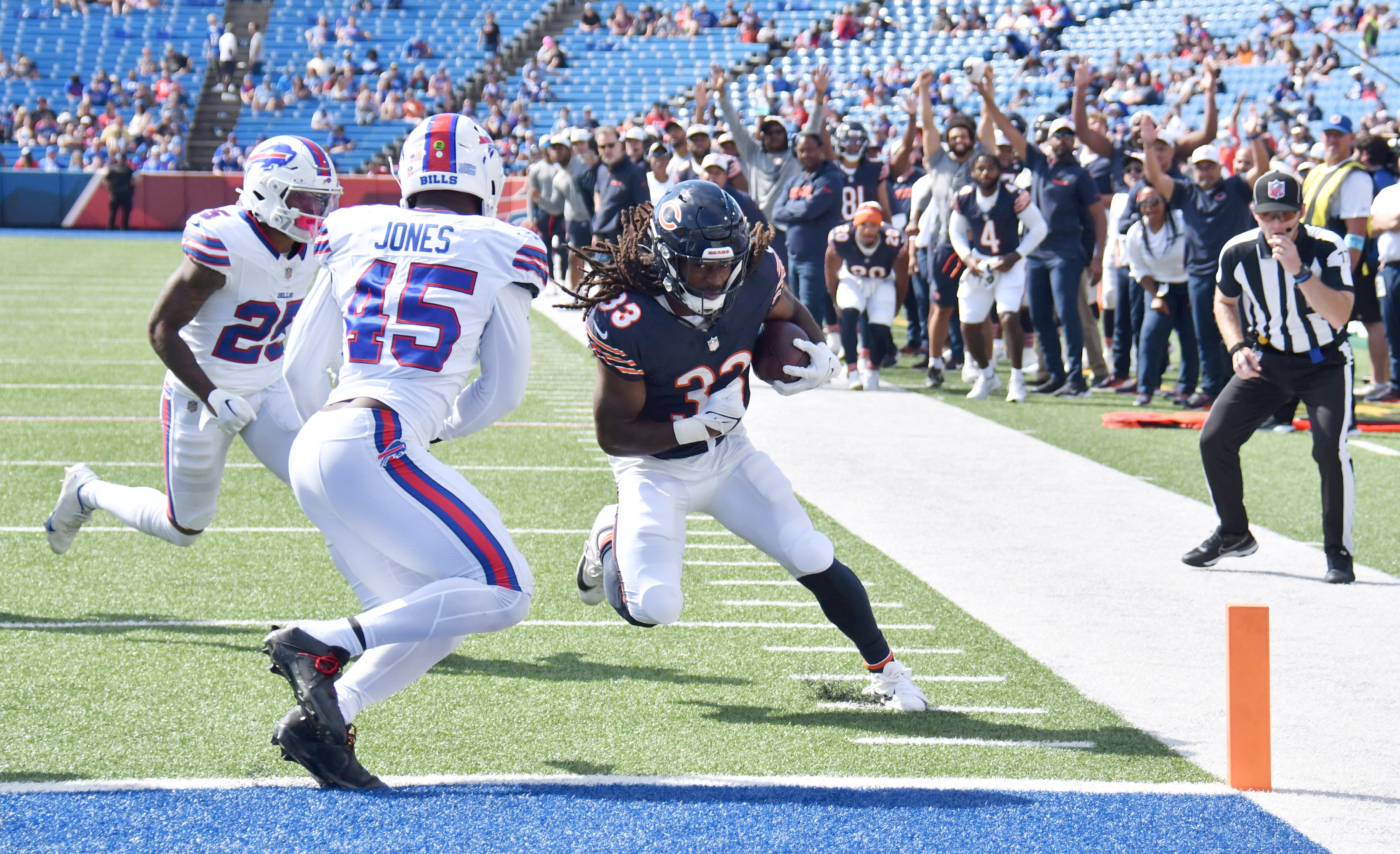 Aug 10, 2024; Orchard Park, New York, USA; Chicago Bears running back Ian Wheeler (33) beats Buffalo Bills linebacker Deion Jones (45) to the endzone to score a touchdown in the fourth quarter of a pre-season game at Highmark Stadium.