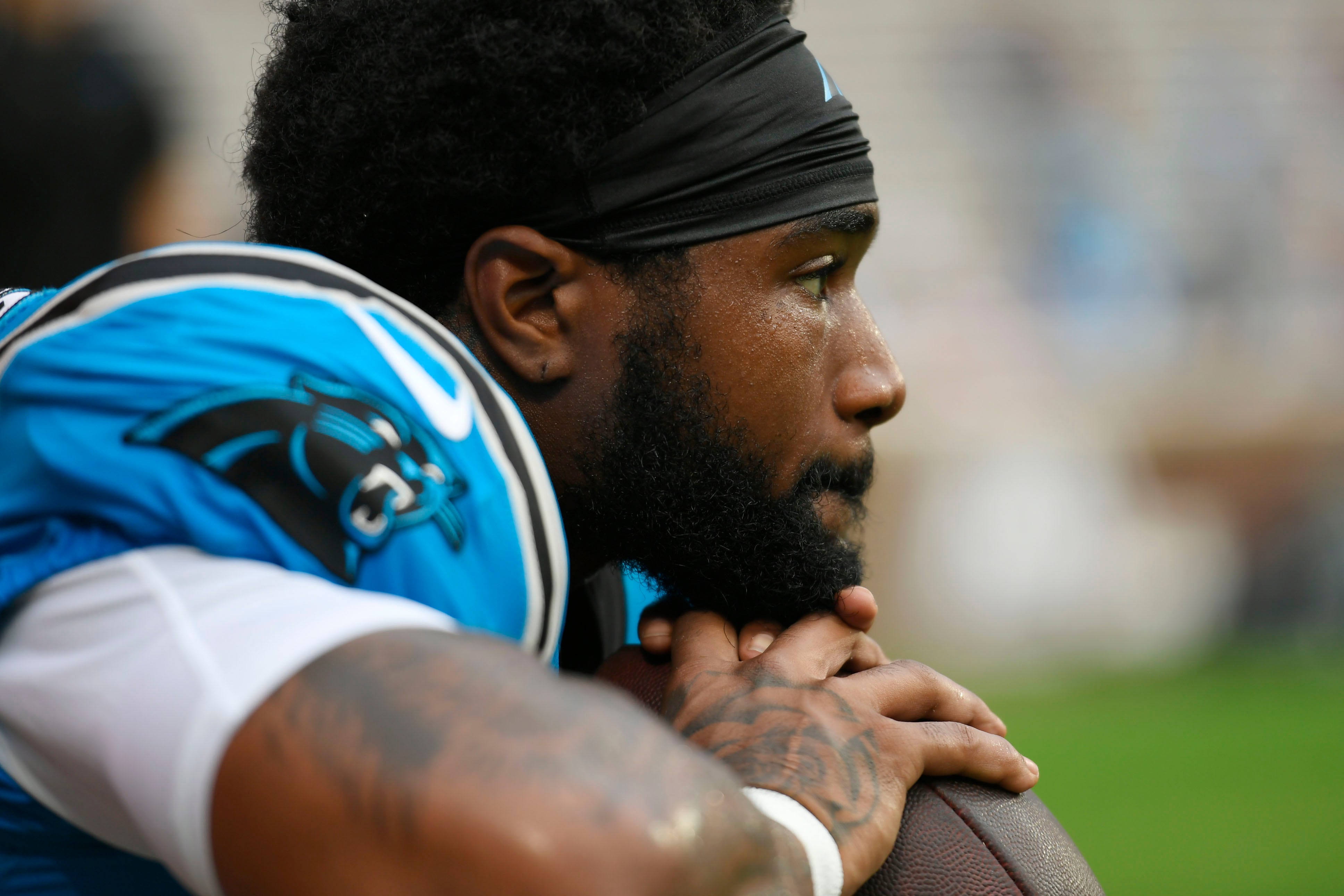 Carolina Panther Miles Sanders (6) takes a moment during warm-ups at Memorial Stadium the Panthers Fan Fest in Clemson, S.C., on Thursday, Aug. 1, 2024.