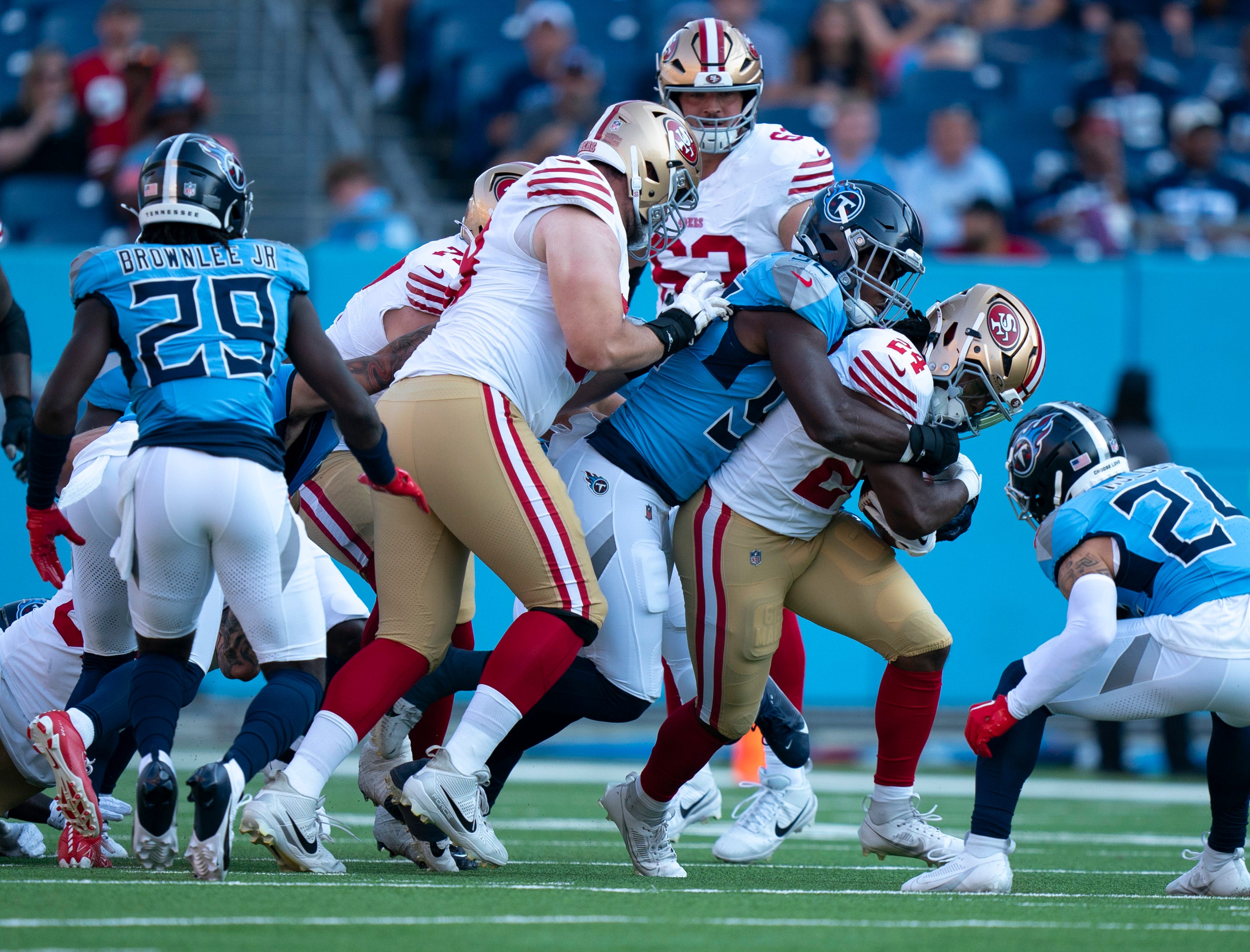 Tennessee Titans linebacker Jaylen Harrell (92) brings down San Francisco 49ers running back Jordan Mason (24) during their first preseason game of the 2024-25 season at Nissan Stadium Saturday, Aug. 10, 2024.