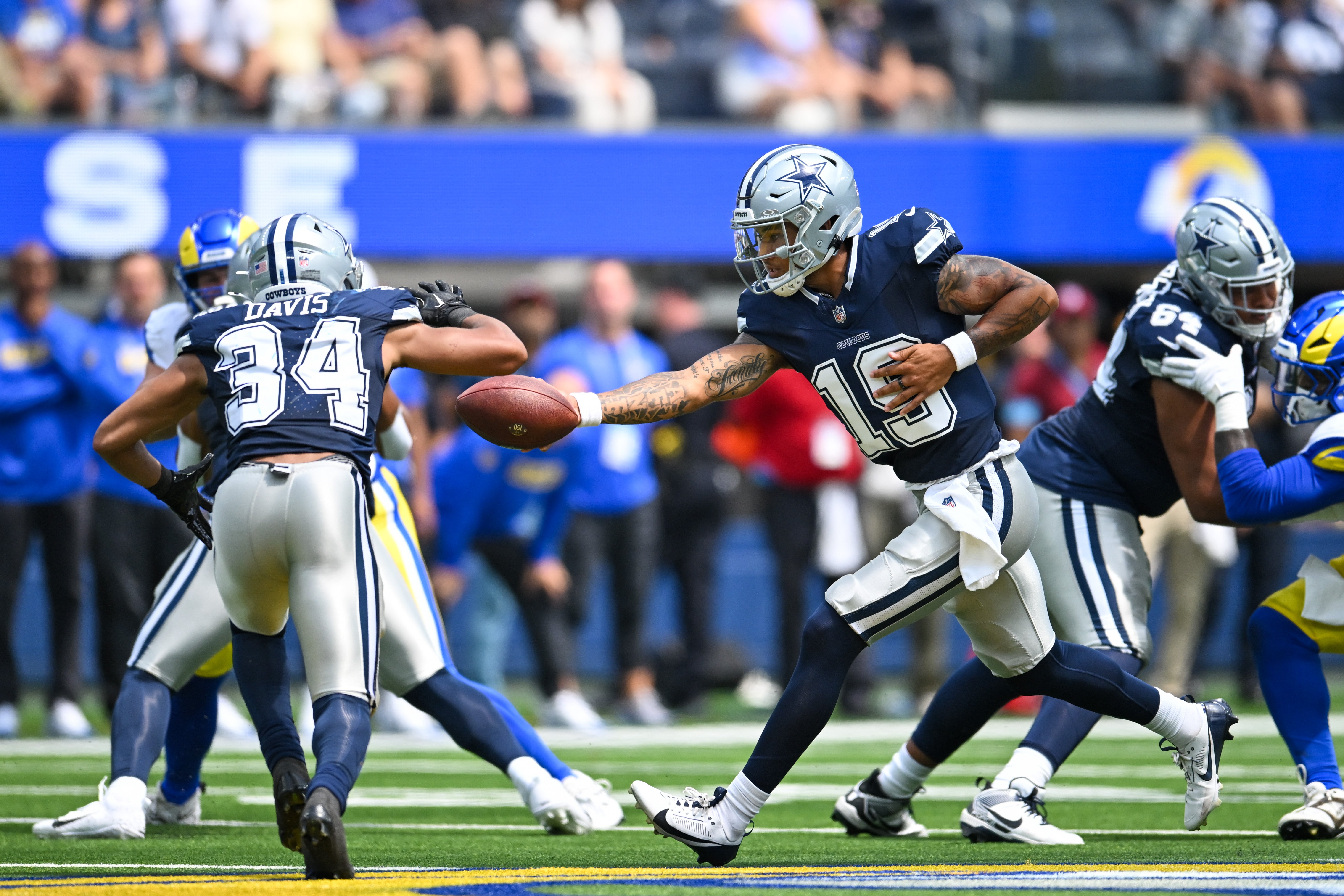 Dallas Cowboys quarterback Trey Lance (19) throws a pass against the Los Angeles Rams during the first quarter at SoFi Stadium.