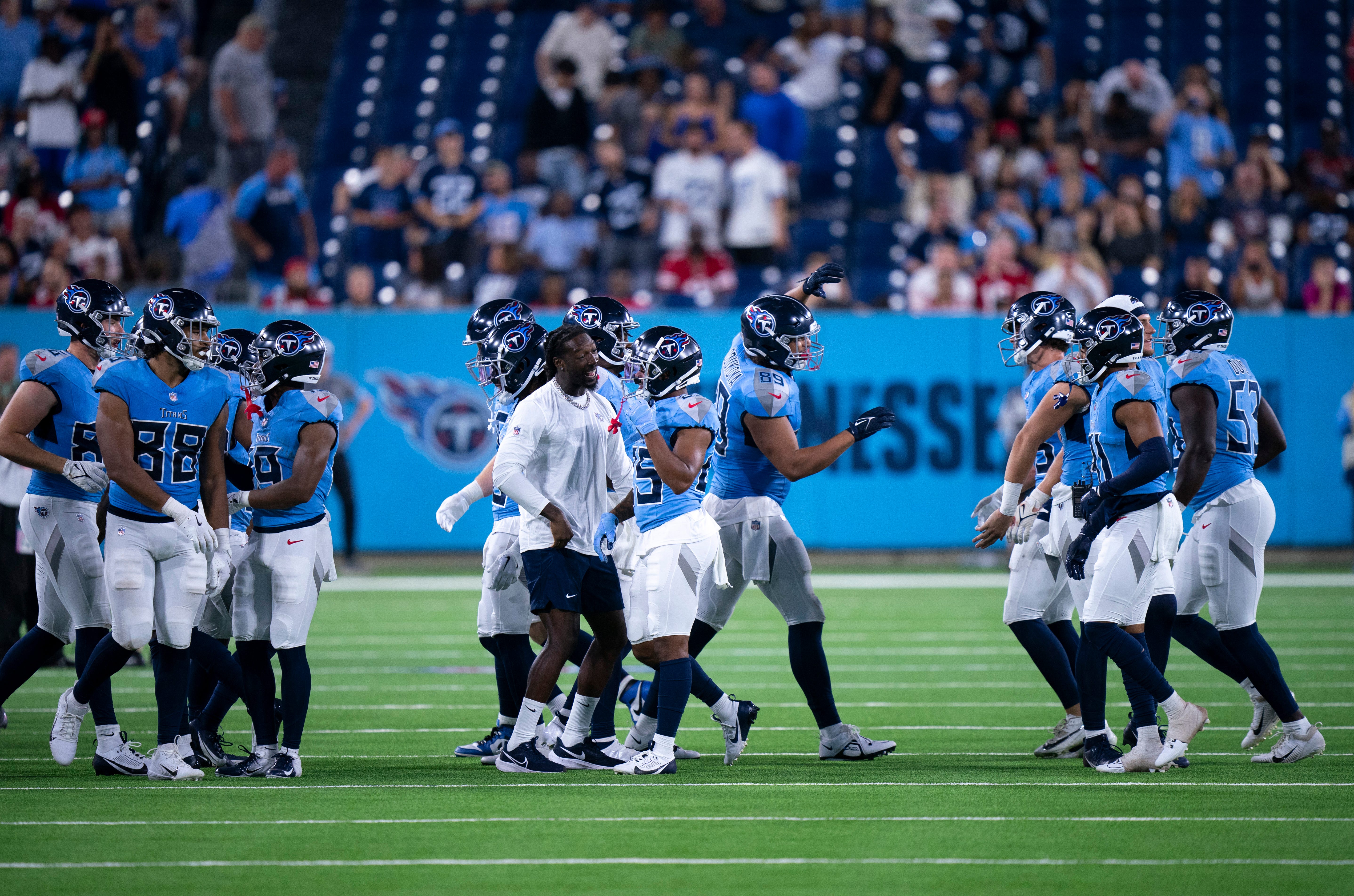 The Tennessee Titans sideline comes out to celebrate a big defensive play near the end of the game against the San Francisco 49ers during their first preseason game of the 2024-25 season at Nissan Sta... Denny Simmons / The Tennessean-USA TODAY NETWORK