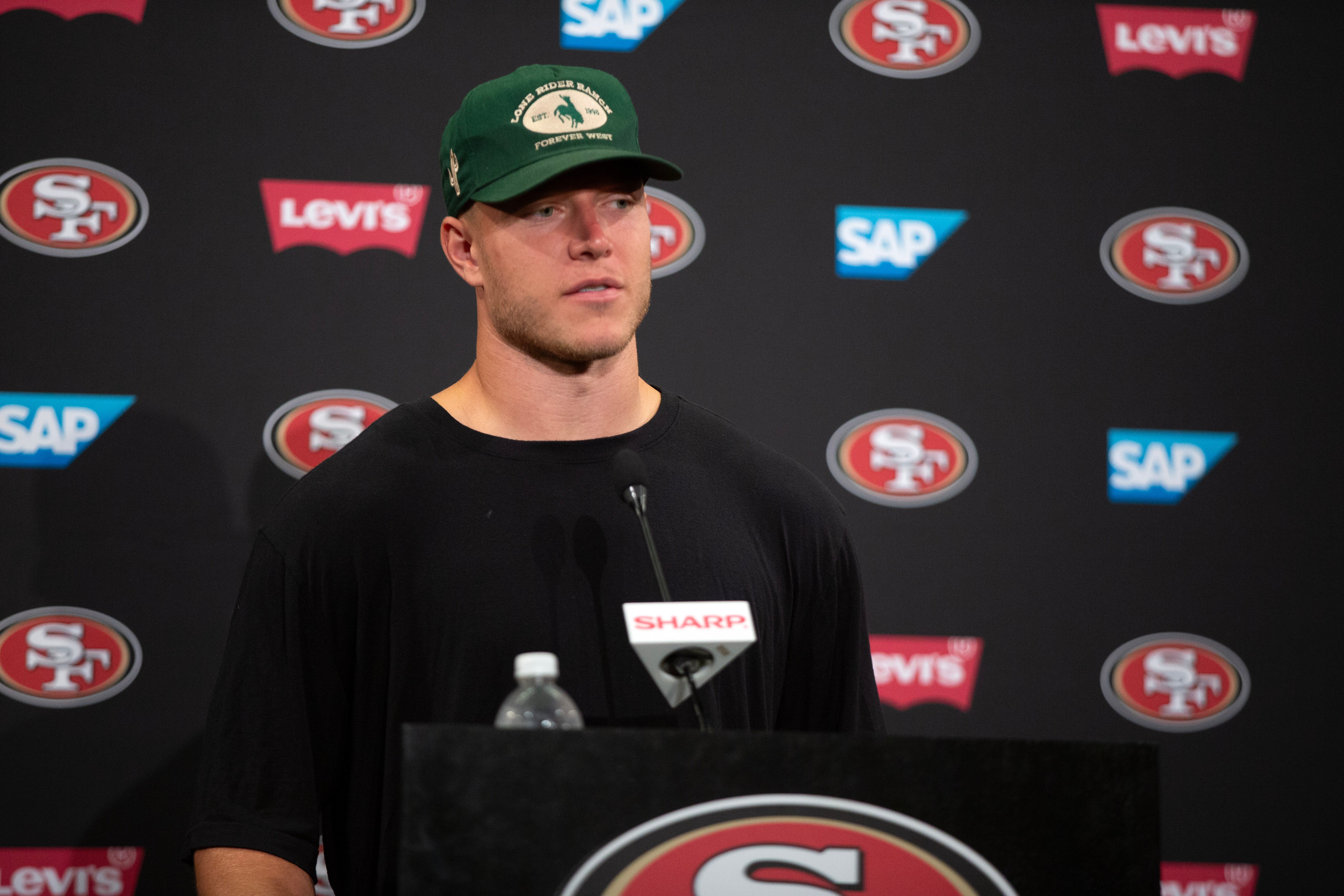 Jul 25, 2024; Santa Clara, CA, USA; San Francisco 49ers running back Christian McCaffrey answers questions at a press conference following Day 3 of training camp at SAP Performance Facility.