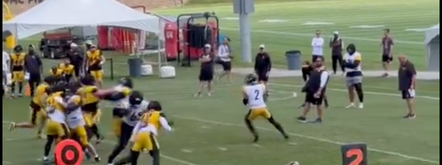 Justin Fields loads up to throw 50-yard bomb to WR Van Jefferson during training camp.