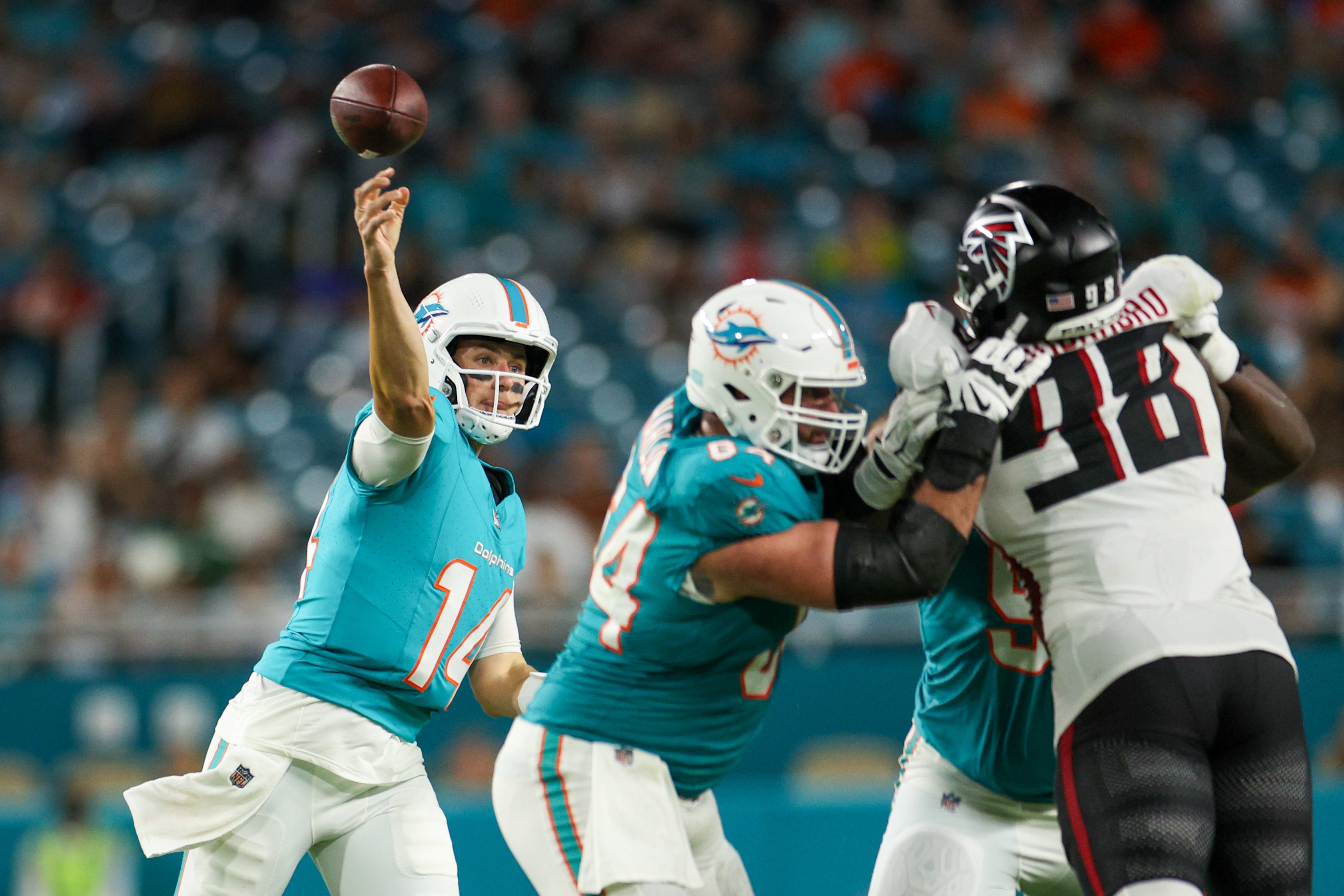 Aug 9, 2024; Miami Gardens, Florida, USA; Miami Dolphins quarterback Mike White (14) throws a pass against the Atlanta Falcons in the third quarter during preseason at Hard Rock Stadium.