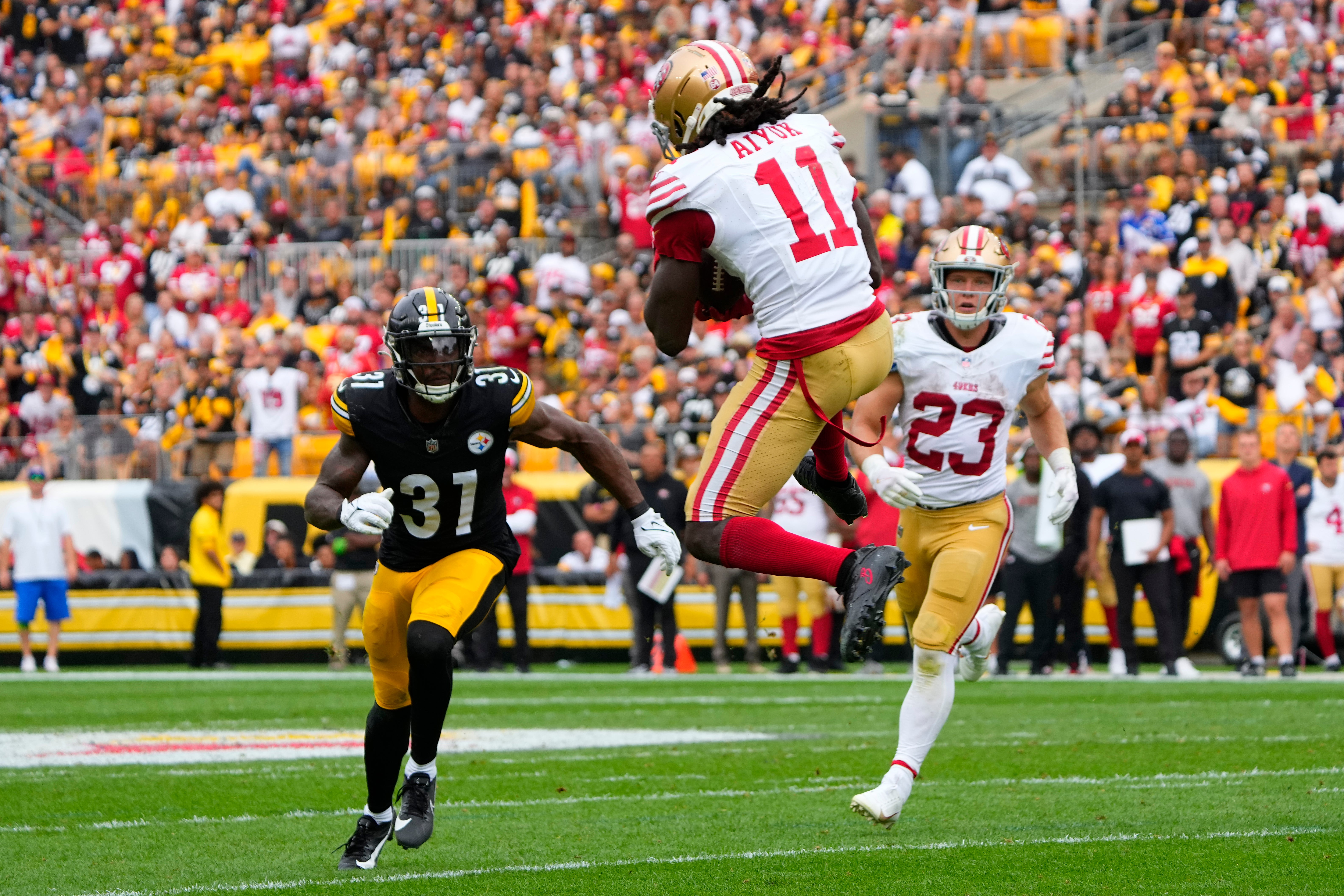 Sep 10, 2023; Pittsburgh, Pennsylvania, USA; San Francisco 49ers wide receiver Brandon Aiyuk (11) makes a catch against the Pittsburgh Steelers during the first half at Acrisure Stadium. Mandatory Credit: Gregory Fisher-USA TODAY Sports