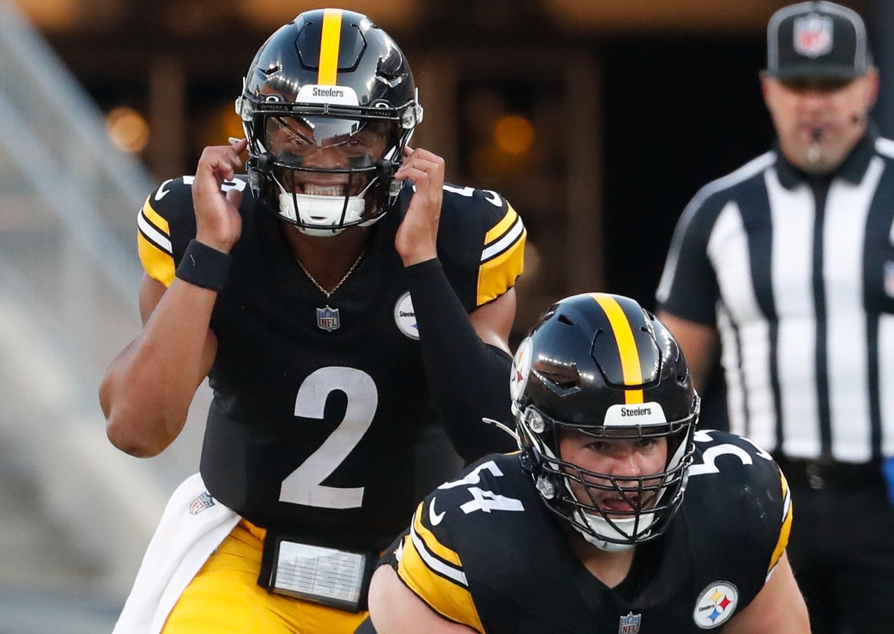 Aug 9, 2024; Pittsburgh, Pennsylvania, USA; Pittsburgh Steelers quarterback Justin Fields (2) calls an audible under center Zach Frazier (54) against the Houston Texans during the first quarter at Acrisure Stadium. Mandatory Credit: Charles LeClaire-USA TODAY Sports  
