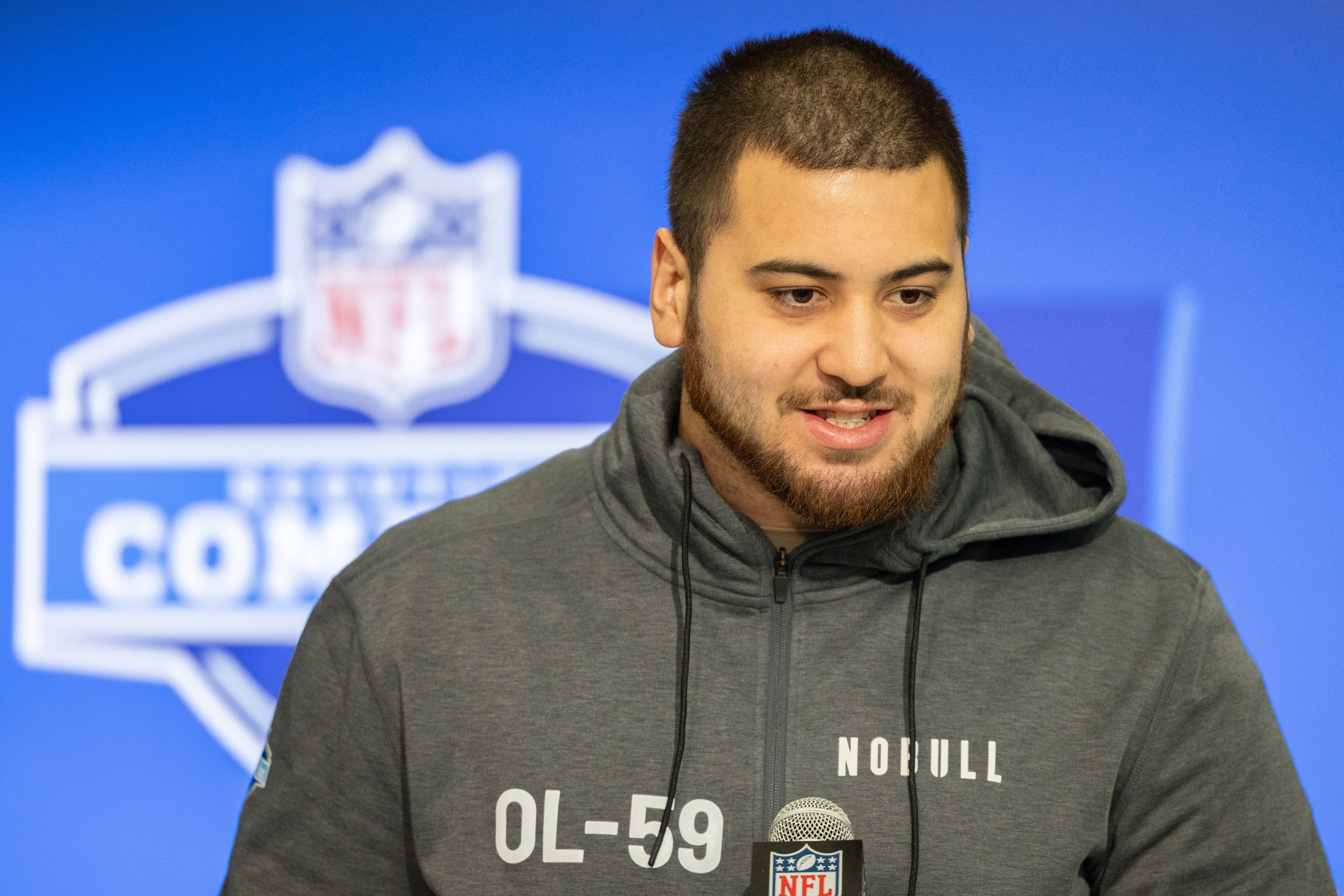 Mar 2, 2024; Indianapolis, IN, USA; Kansas offensive lineman Dominick Puni (OL59) talks to the media during the 2024 NFL Combine at Lucas Oil Stadium.