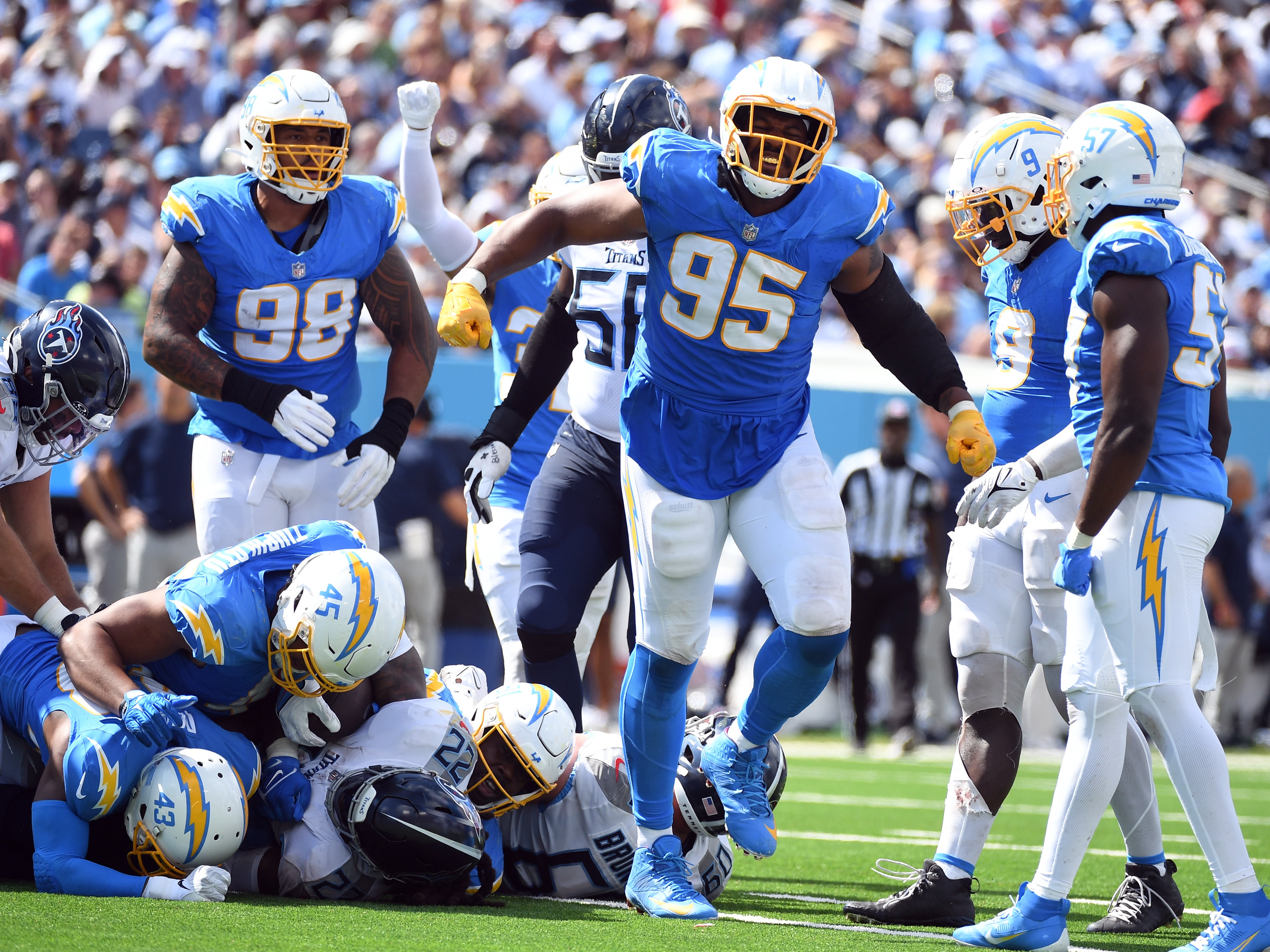 Sep 17, 2023; Nashville, Tennessee, USA; Los Angeles Chargers defensive tackle Nick Williams (95) celebrates after a defensive stop during the second half against the Tennessee Titans at Nissan Stadium.