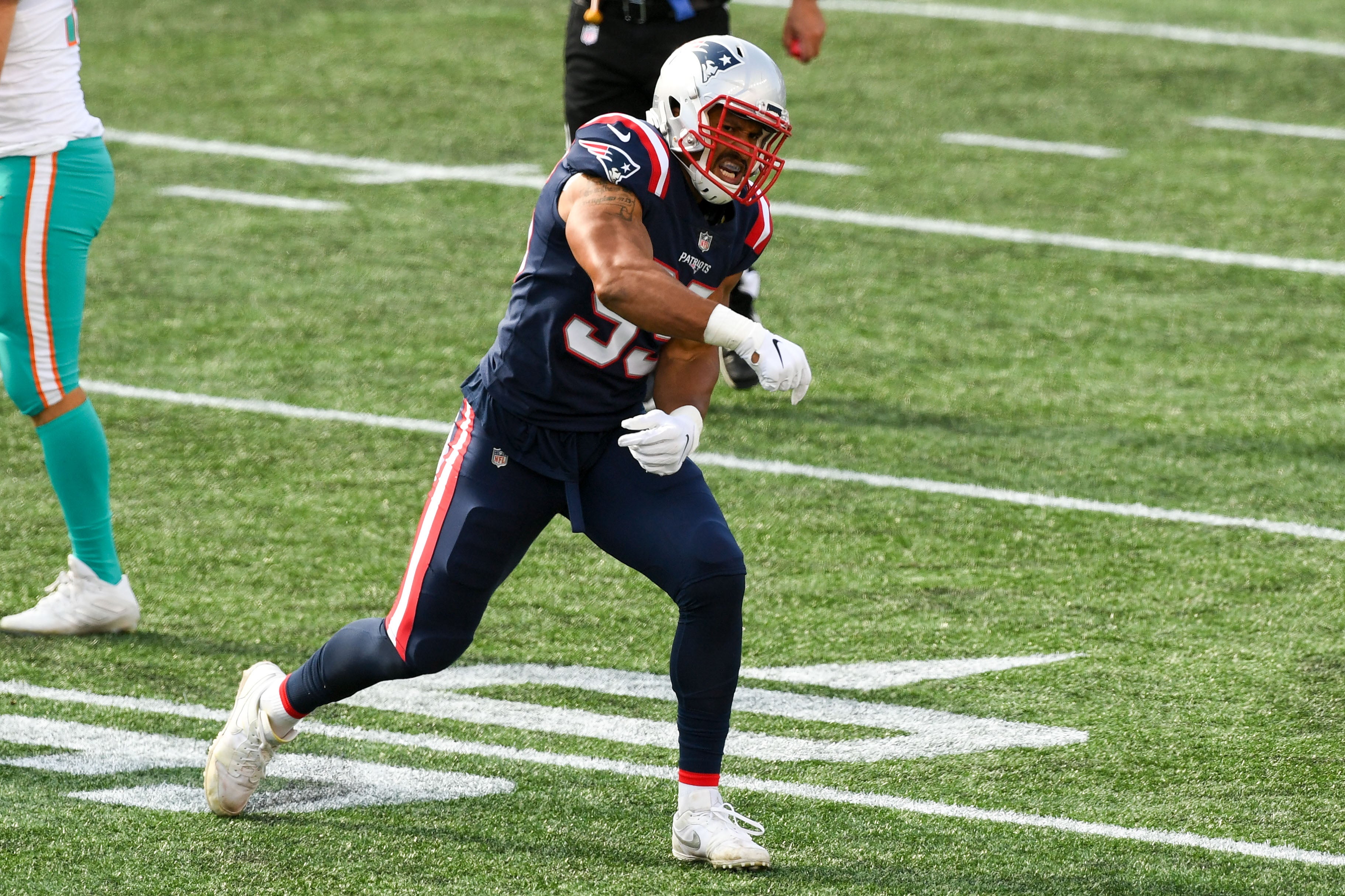 Sep 13, 2020; Foxborough, Massachusetts, USA; New England Patriots defensive end Derek Rivers (95) reacts after sacking Miami Dolphins quarterback Ryan Fitzpatrick (not seen) during the second half at Gillette Stadium.