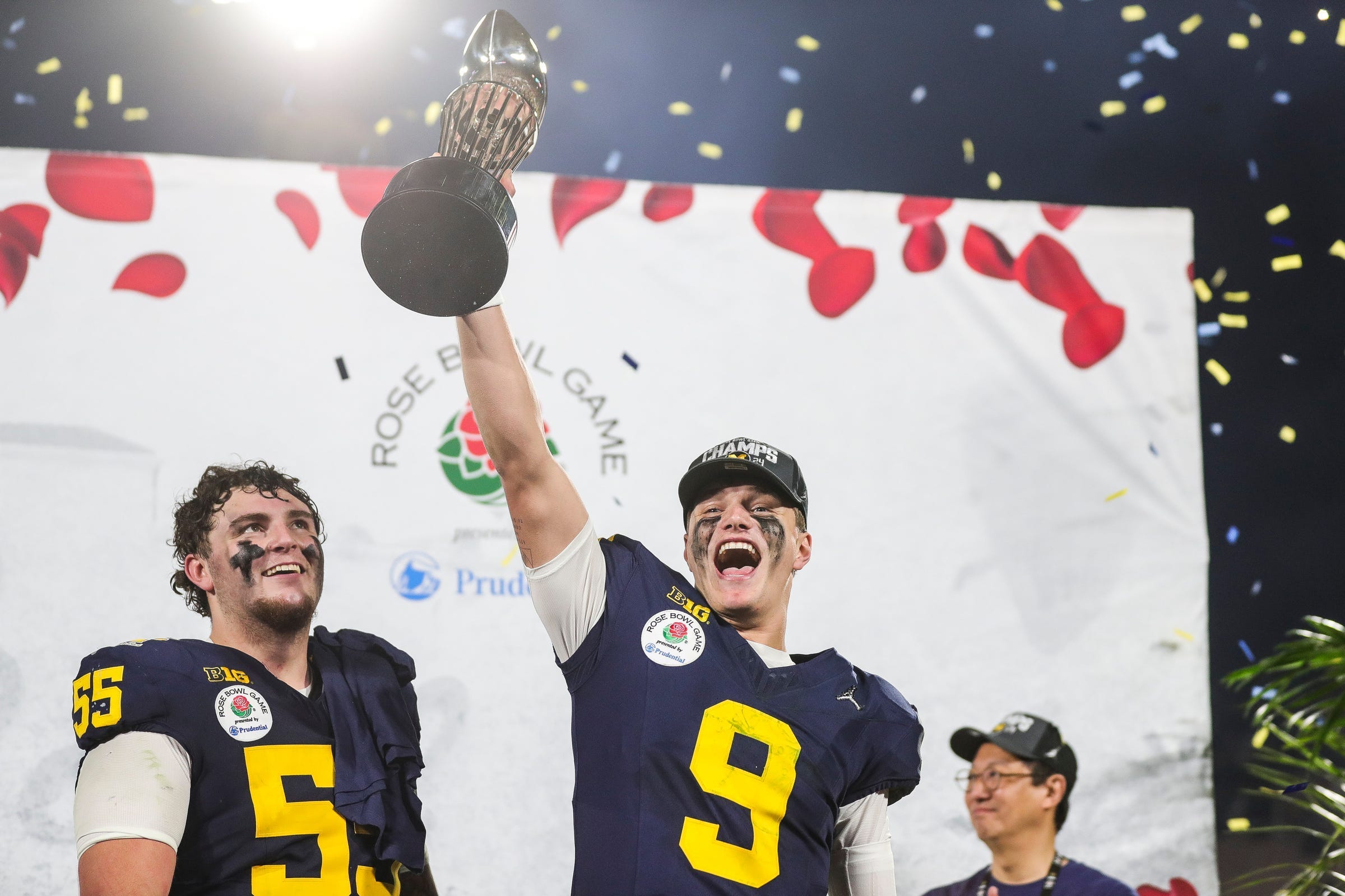 J.J. McCarthy hoisting the trophy for Michigan