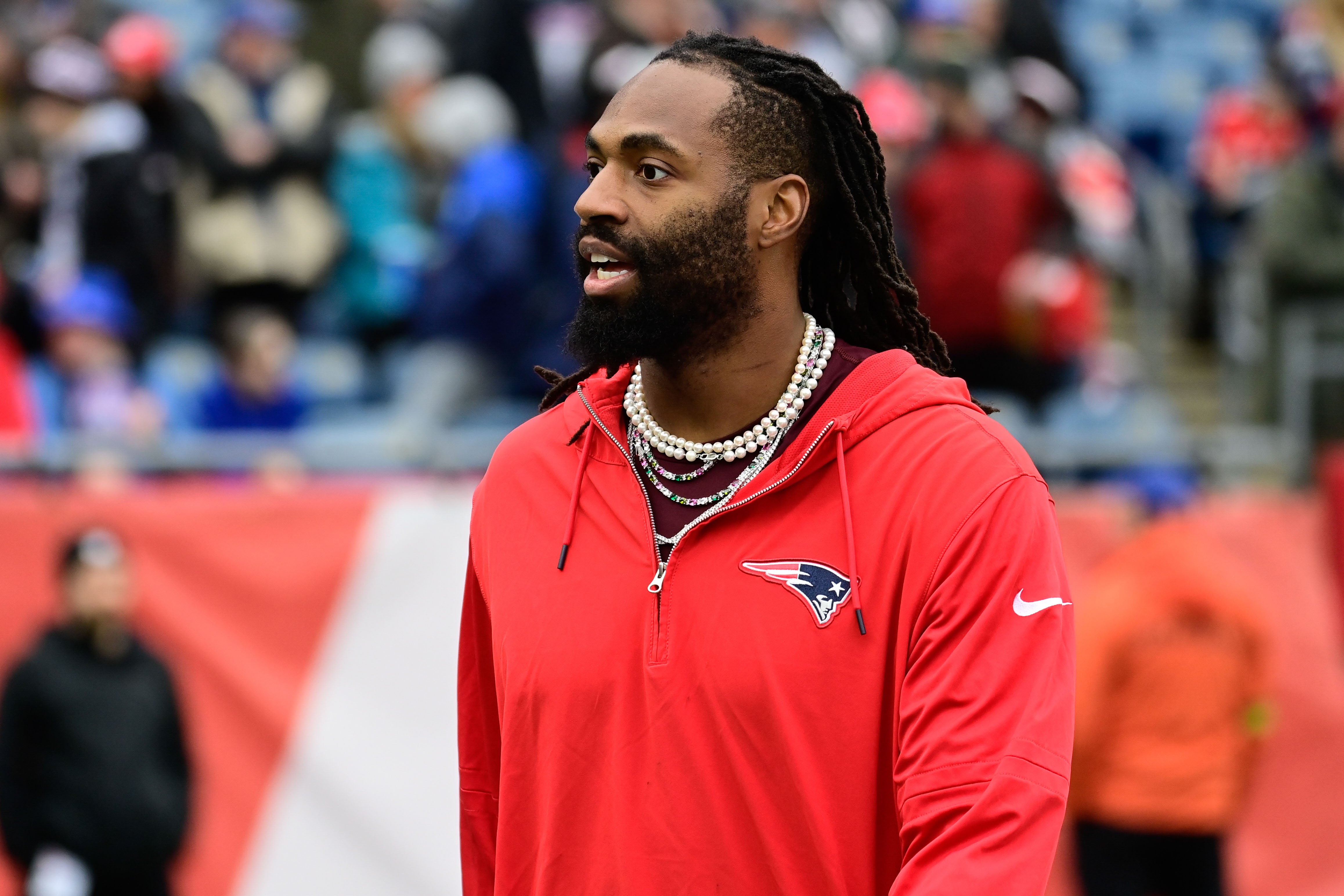 Dec 17, 2023; Foxborough, Massachusetts, USA; New England Patriots linebacker Matthew Judon (9) greets fans before a game against the Kansas City Chiefs at Gillette Stadium.