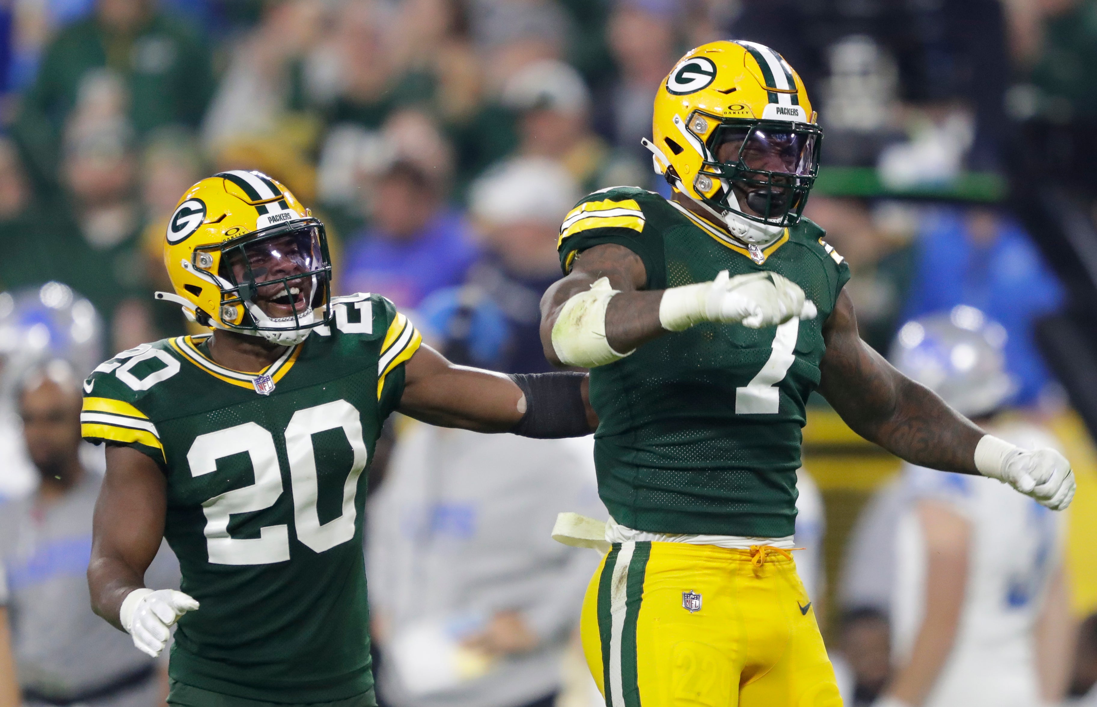 Sep 28, 2023; Green Bay, Wisconsin, USA; Green Bay Packers linebacker Quay Walker (7) celebrates making a tackle for a loss against the Detroit Lions during their football game Thursday, September 28, 2023, at Lambeau Field in Green Bay, Wis. At left is safety Rudy Ford (20). Mandatory Credit: Dan Powers-USA TODAY Sports