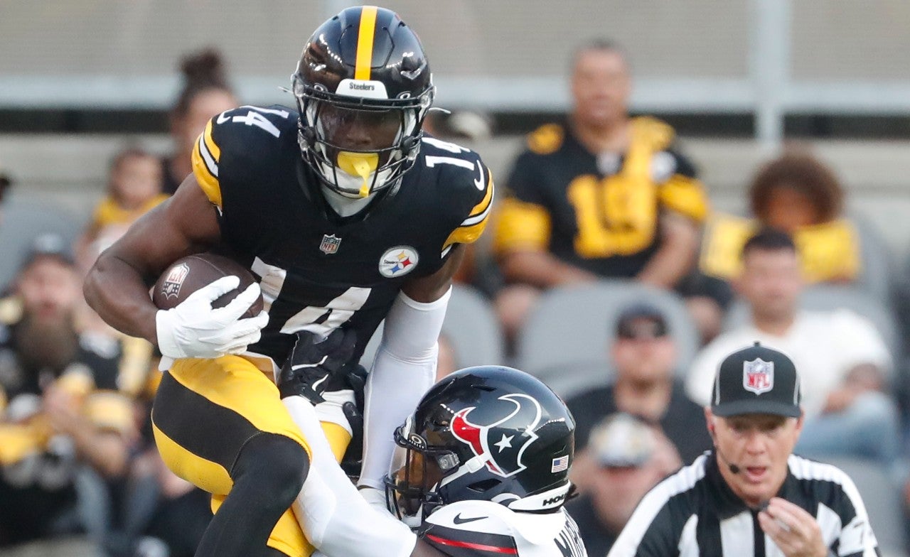 Aug 9, 2024; Pittsburgh, Pennsylvania, USA; Pittsburgh Steelers wide receiver George Pickens (14) is forced out of bounds after a catch by Houston Texans safety Eric Murray (23) during the first quarter at Acrisure Stadium. Mandatory Credit: Charles LeClaire-USA TODAY Sports