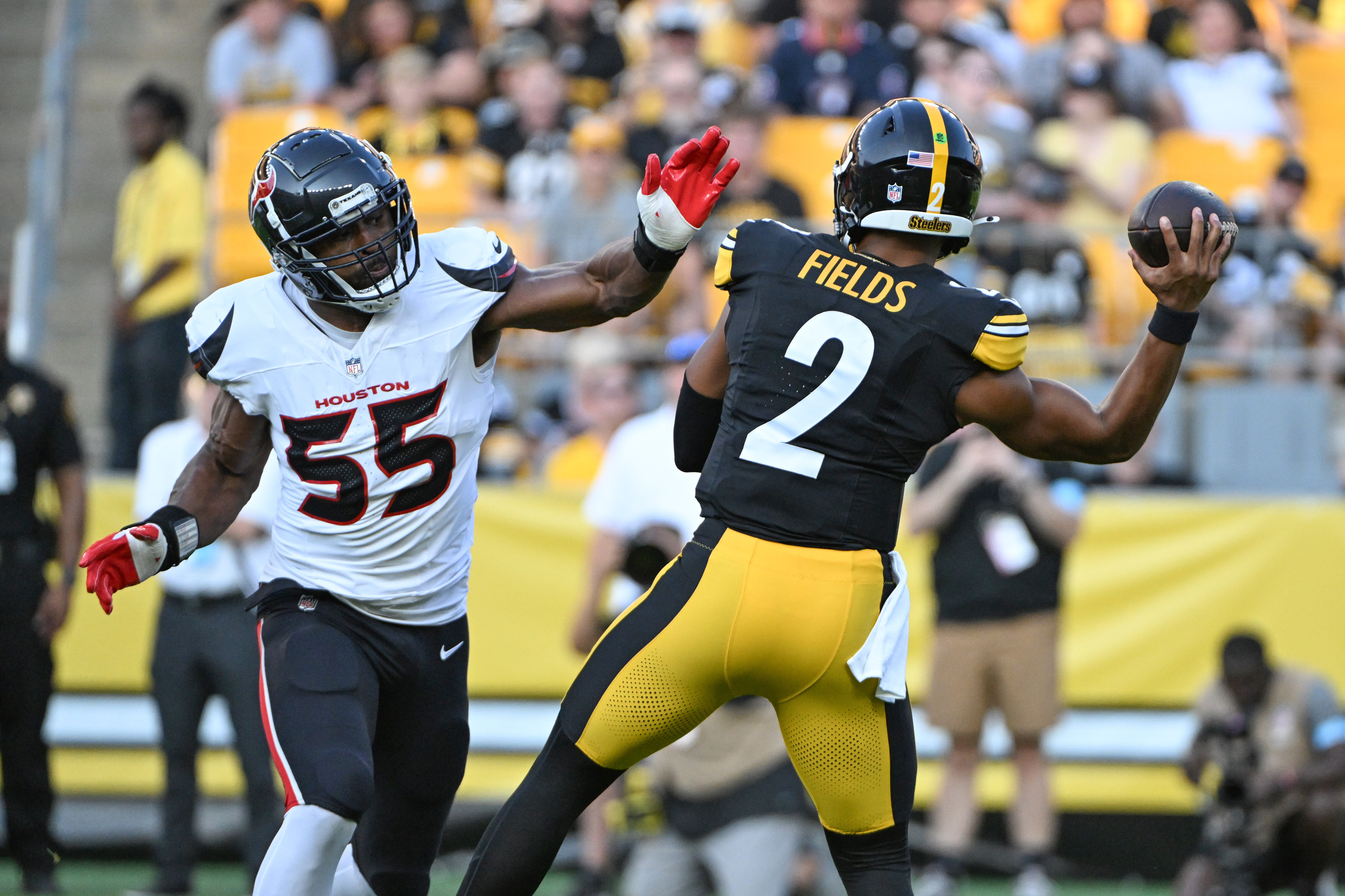 Aug 9, 2024; Pittsburgh, Pennsylvania, USA; Houston Texans defensive end Danielle Hunter (55) pressures Pittsburgh Steelers quarterback Justin Fields (2) during the first quarter at Acrisure Stadium. Mandatory Credit: Barry Reeger-USA TODAY Sports
