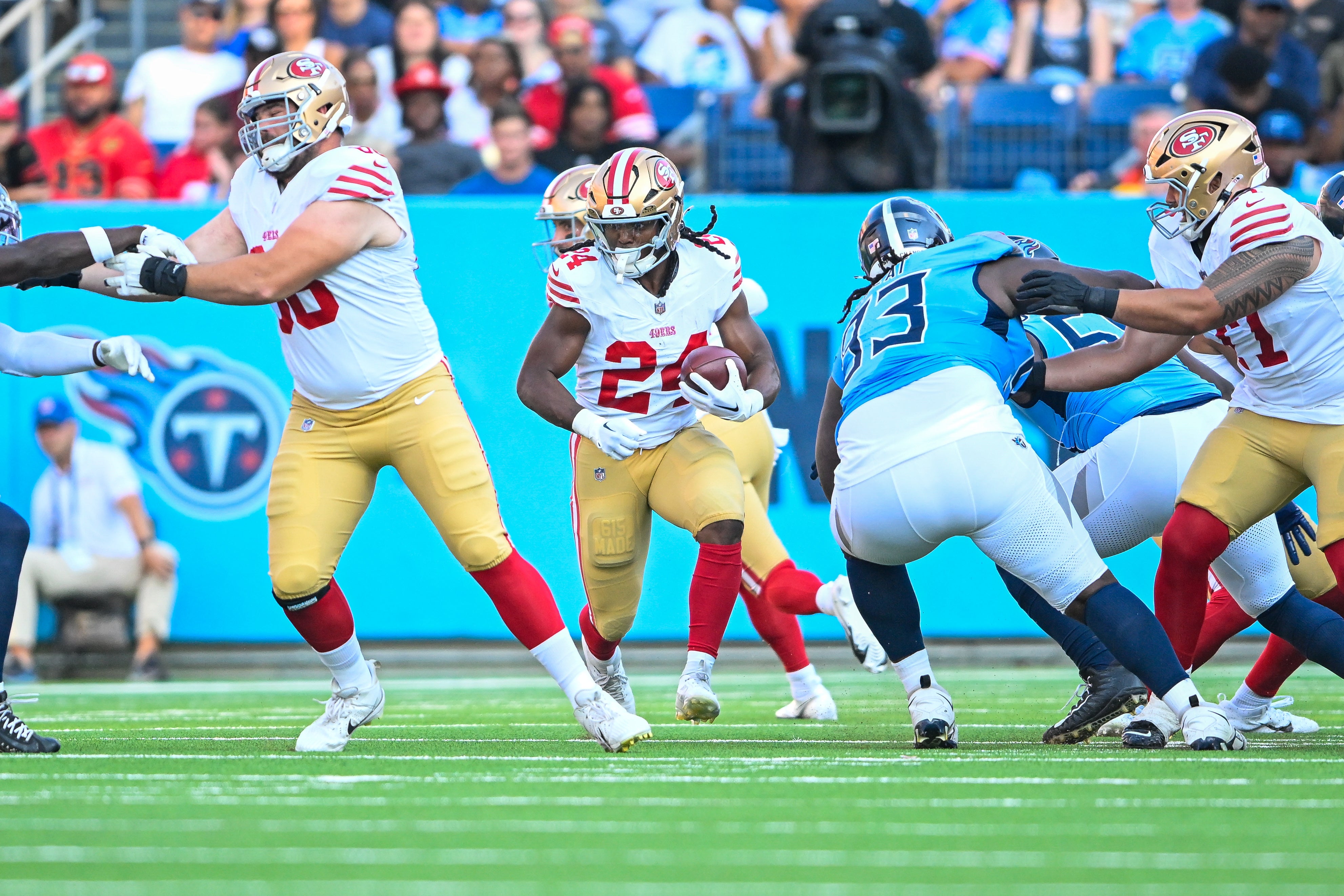 Aug 10, 2024; Nashville, Tennessee, USA; San Francisco 49ers running back Jordan Mason (24) runs the ball against the Tennessee Titans during the first half at Nissan Stadium.