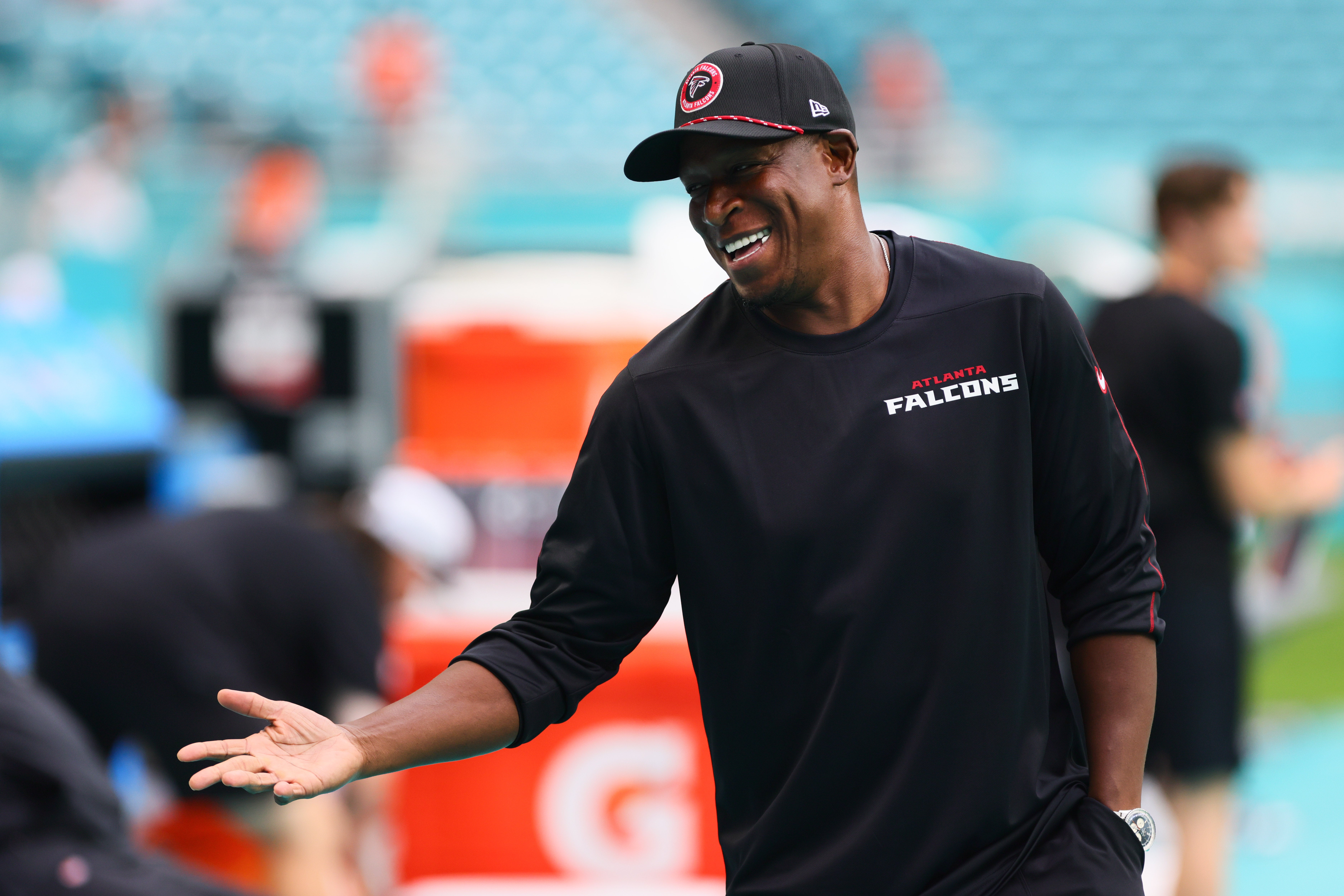Atlanta Falcons head coach Raheem Morris reacts while talking on the sidelines prior to a preseason game against the Miami Dolphins at Hard Rock Stadium.