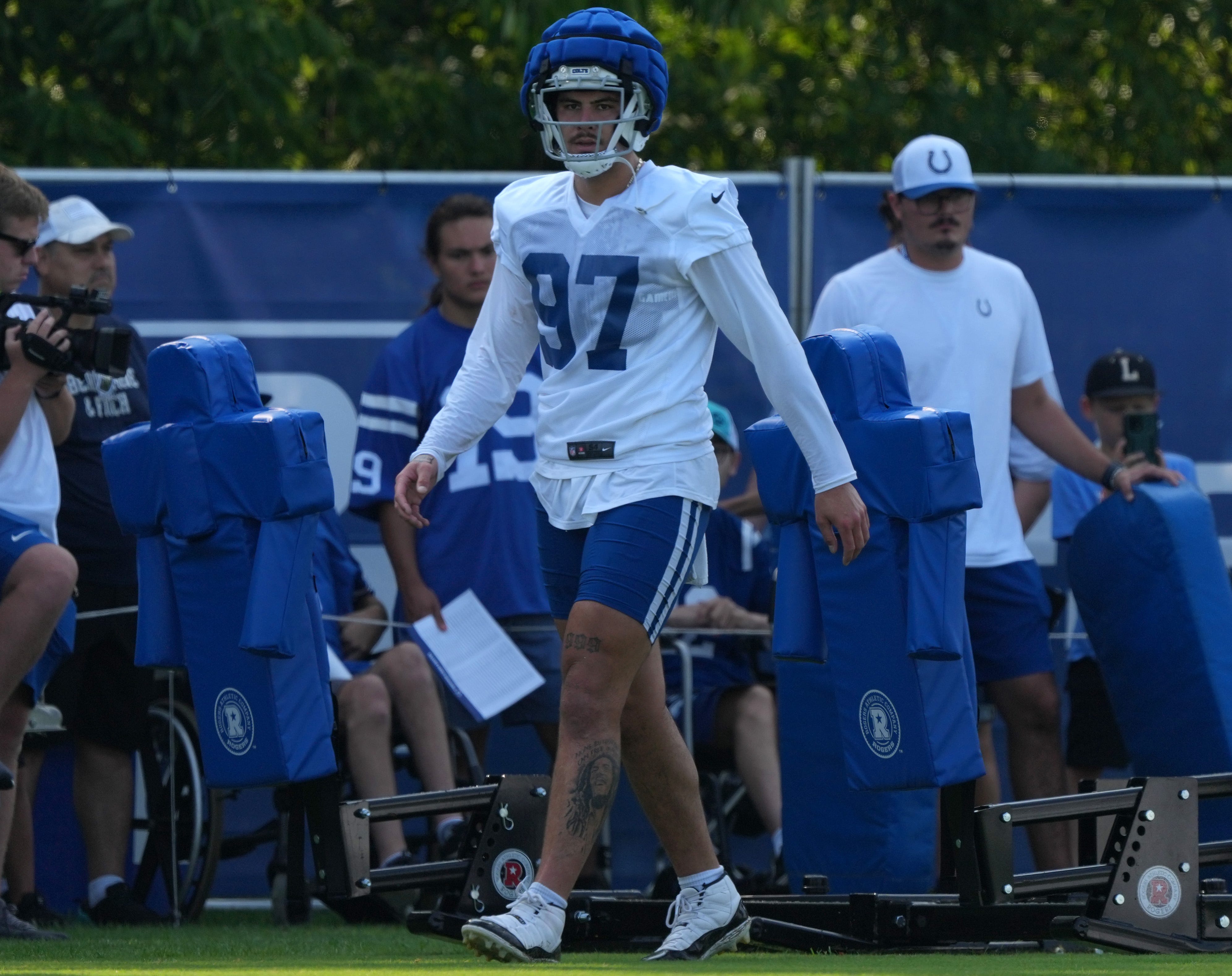 Indianapolis Colts defensive end Laiatu Latu (97) walks across the field during the first day of the Indianapolis Colts’ training camp Thursday, July 25, 2024, at Grand Park Sports Complex in Westfield.
