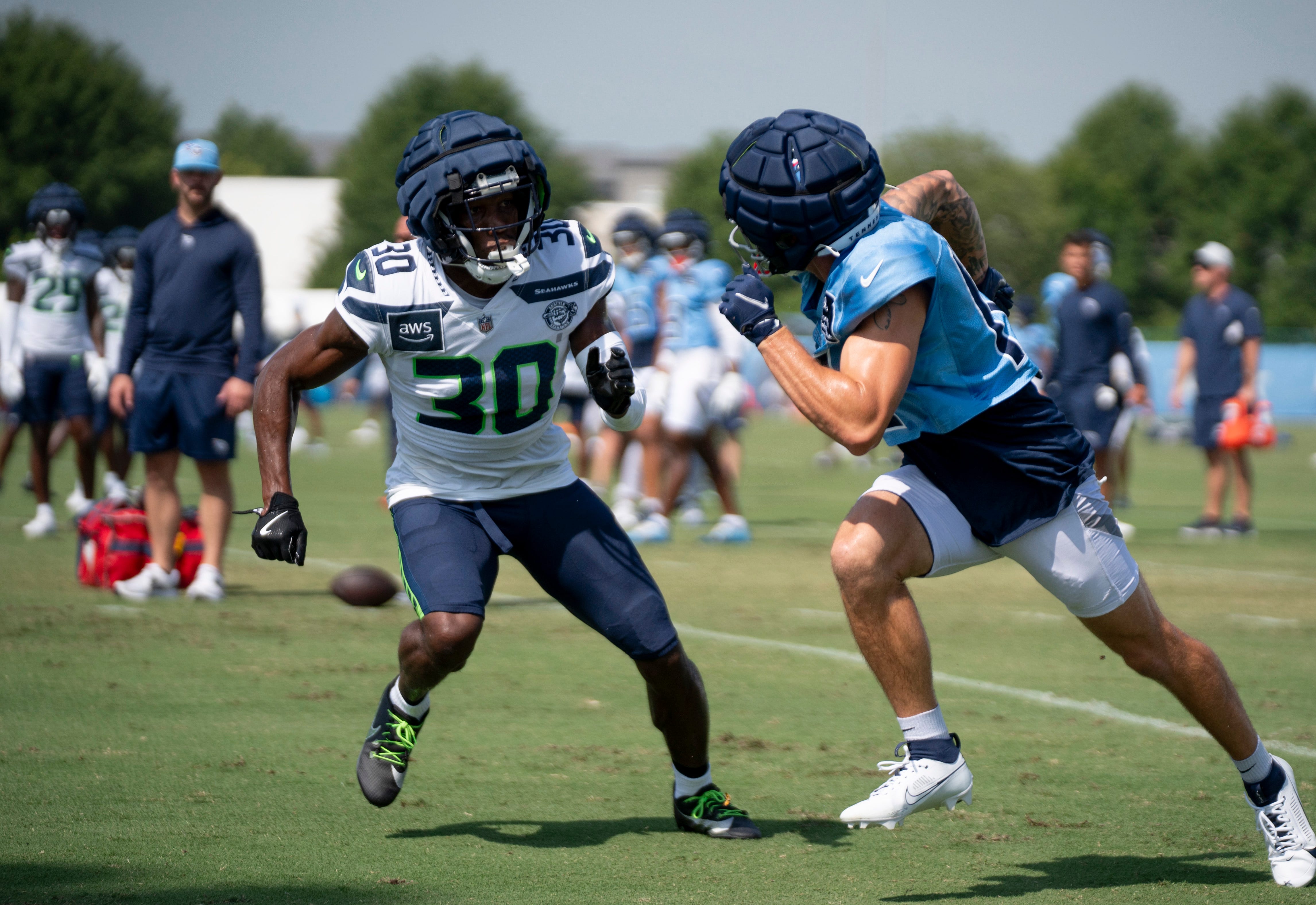 Seattle Seahawks cornerback Michael Jackson (30) guards Tennessee Titans wide receiver Mason Kinsey (12) at Ascension Saint Thomas Sports Park in Nashville, Tenn., Thursday, Aug. 15, 2024. This is the... Denny Simmons / The Tennessean-USA TODAY NETWORK