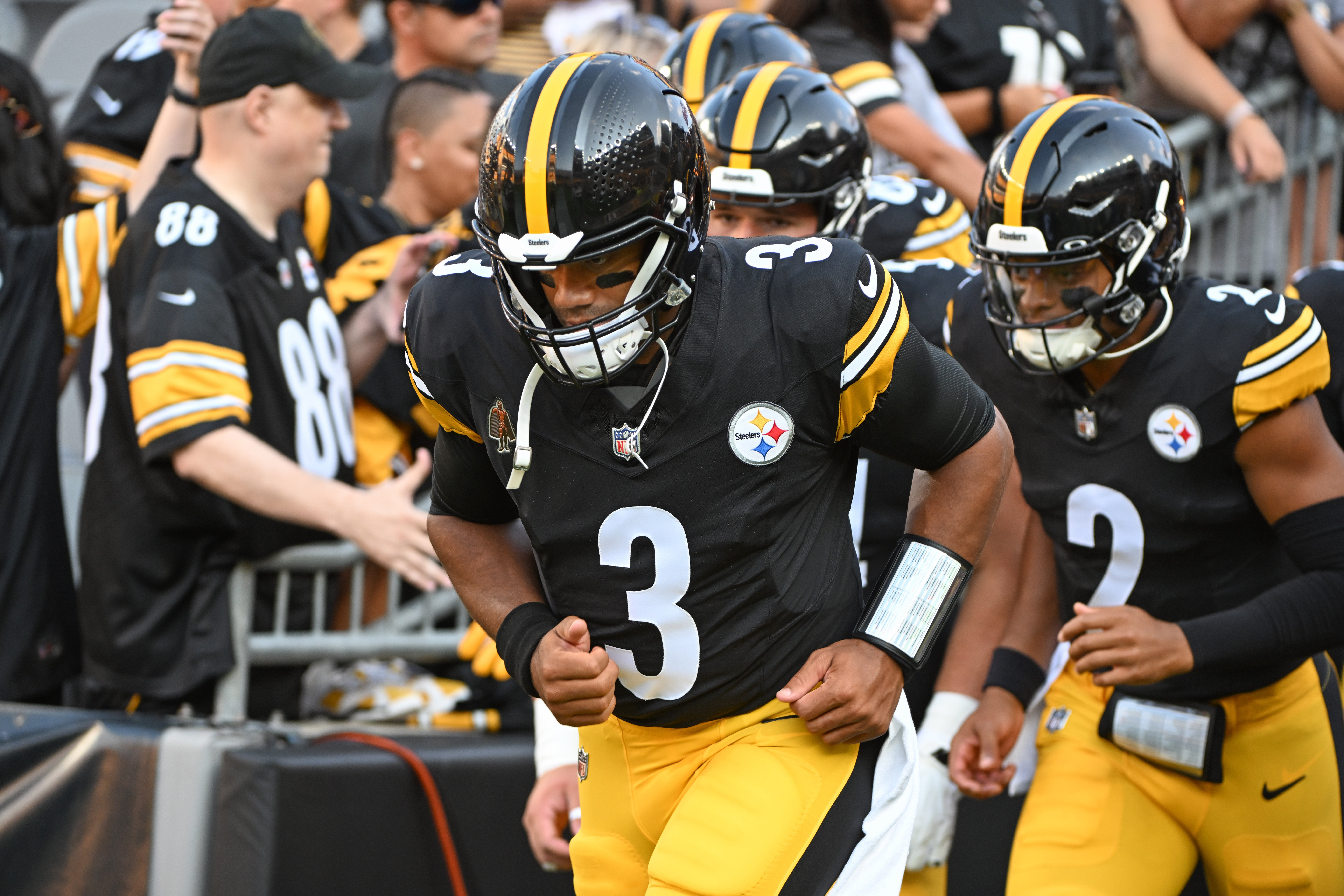 Aug 9, 2024; Pittsburgh, Pennsylvania, USA; Pittsburgh Steelers quarterback Russell Wilson (3) and Justin Fields (2) take the field for pre-game against the Houston Texans at Acrisure Stadium. Mandatory Credit: Barry Reeger-USA TODAY Sports