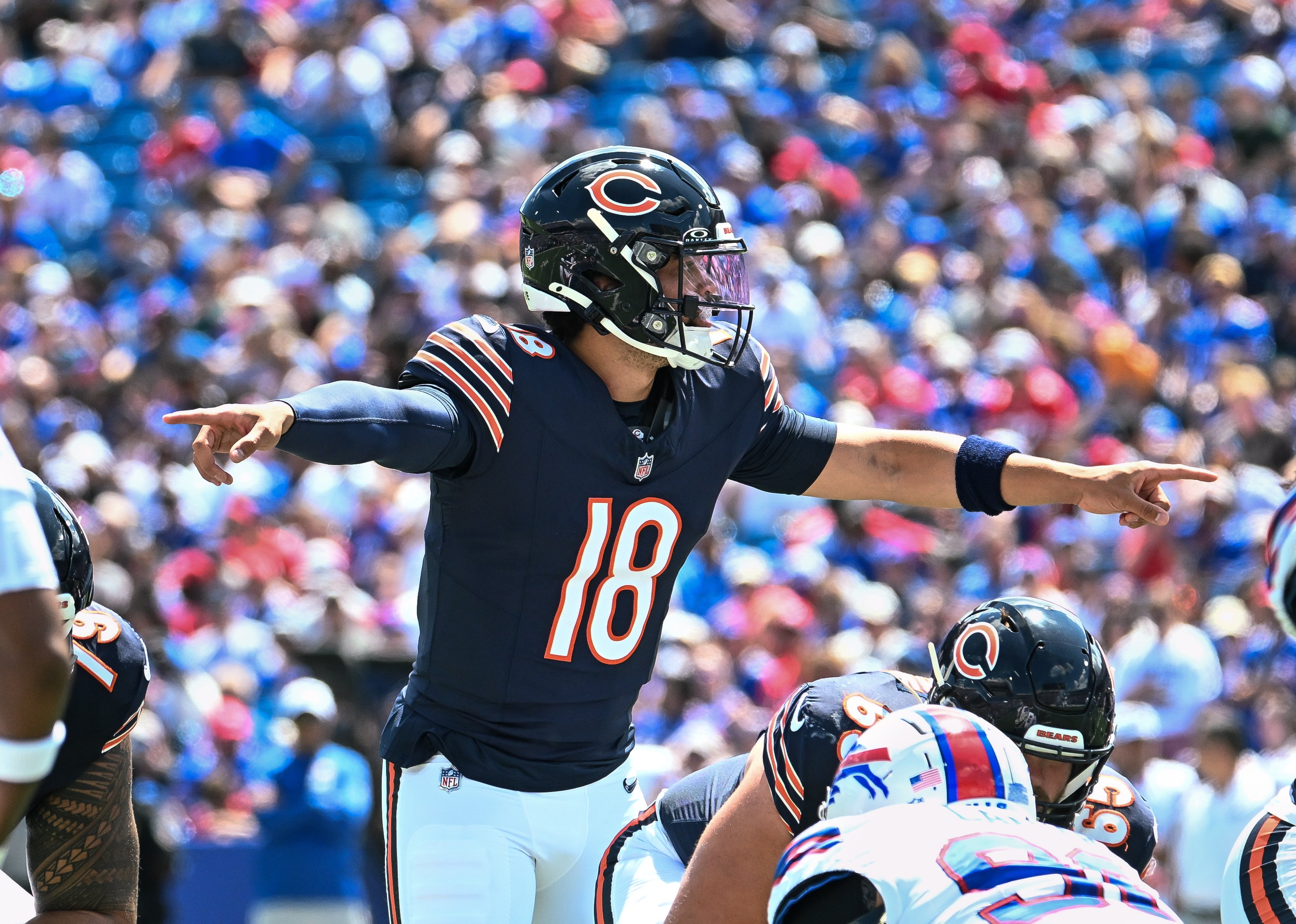 Aug 10, 2024; Orchard Park, New York, USA; Chicago Bears quarterback Caleb Williams (18) directs his team at the line of scrimmage in the first quarter of a pre-season game against the Buffalo Bills at Highmark Stadium.