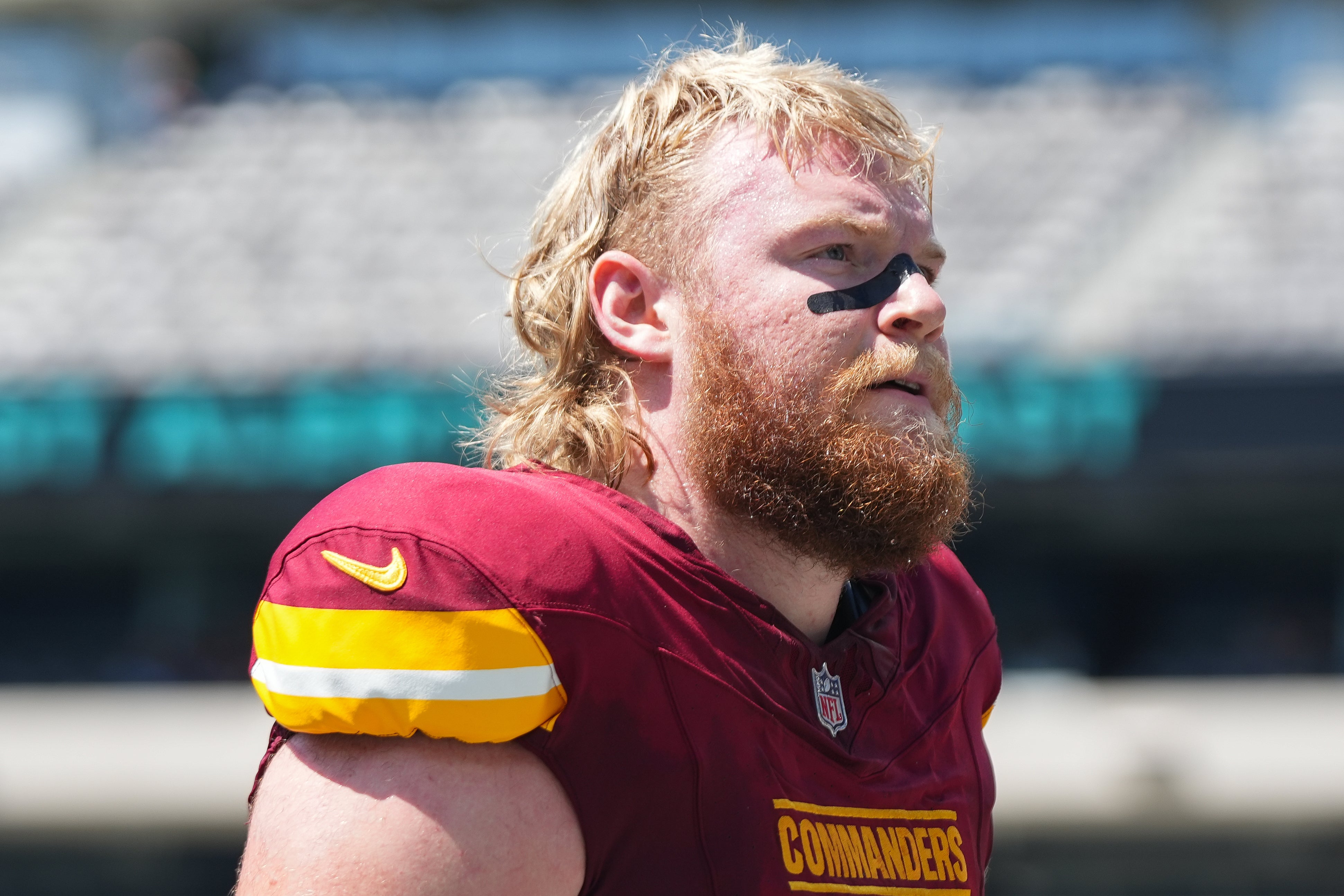 Aug 10, 2024; East Rutherford, New Jersey, USA; Washington Commanders offensive guard Mason Brooks (64) exits the field before the game against the New York Jets at MetLife Stadium. Mandatory Credit: Lucas Boland-USA TODAY Sports