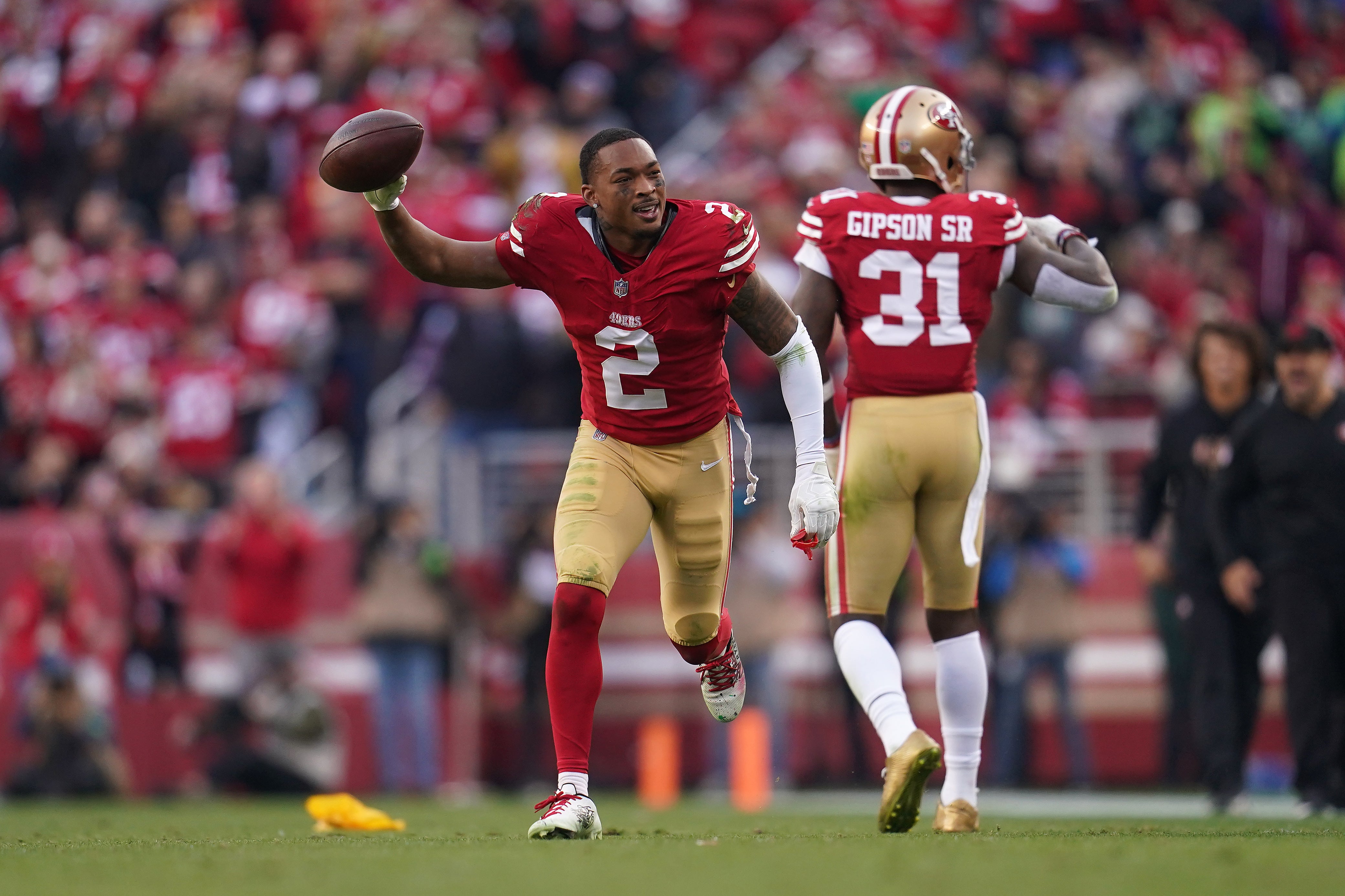 Dec 10, 2023; Santa Clara, California, USA; San Francisco 49ers cornerback Deommodore Lenoir (2) holds onto the ball after breaking up a pass attempt against the Seattle Seahawks in the fourth quarter at Levi's Stadium.