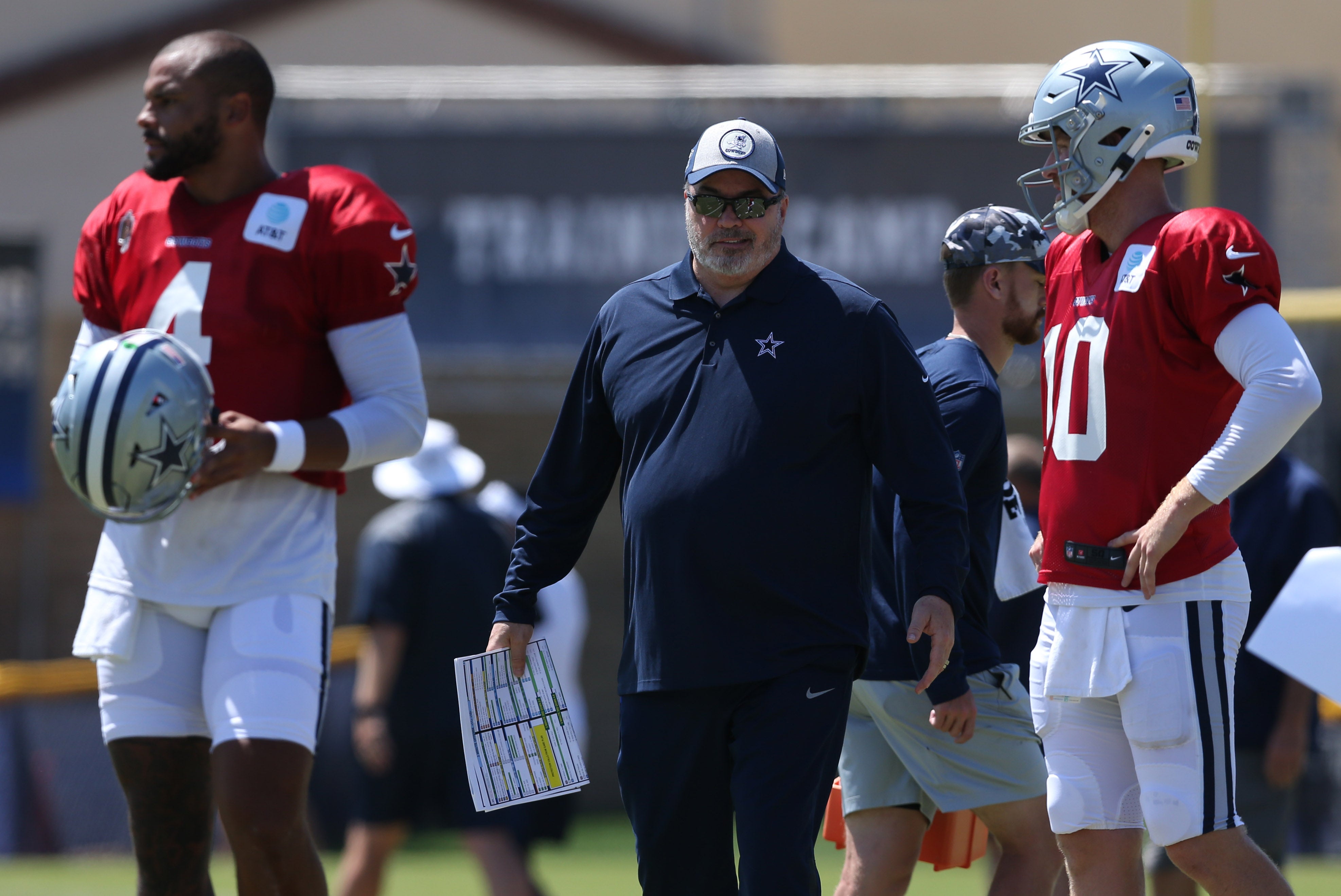 Dallas Cowboys head coach Mike McCarthy, Dak Prescott, and Cooper Rush in practice.