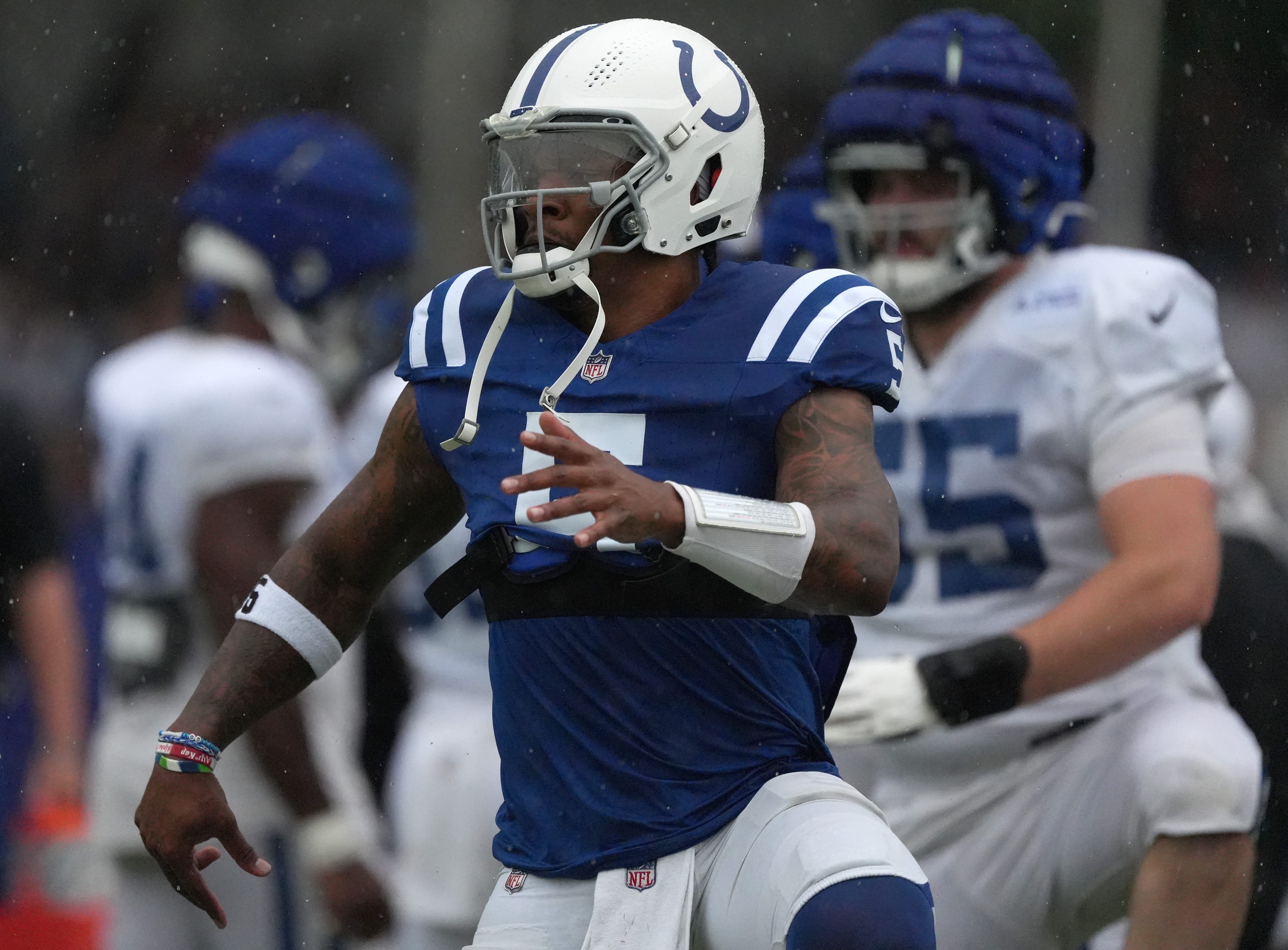Indianapolis Colts quarterback Anthony Richardson (5) warms up in the rain during a joint practice with the Arizona Cardinals on Thursday, Aug. 15, 2024, at Grand Park Sports Complex in Westfield.