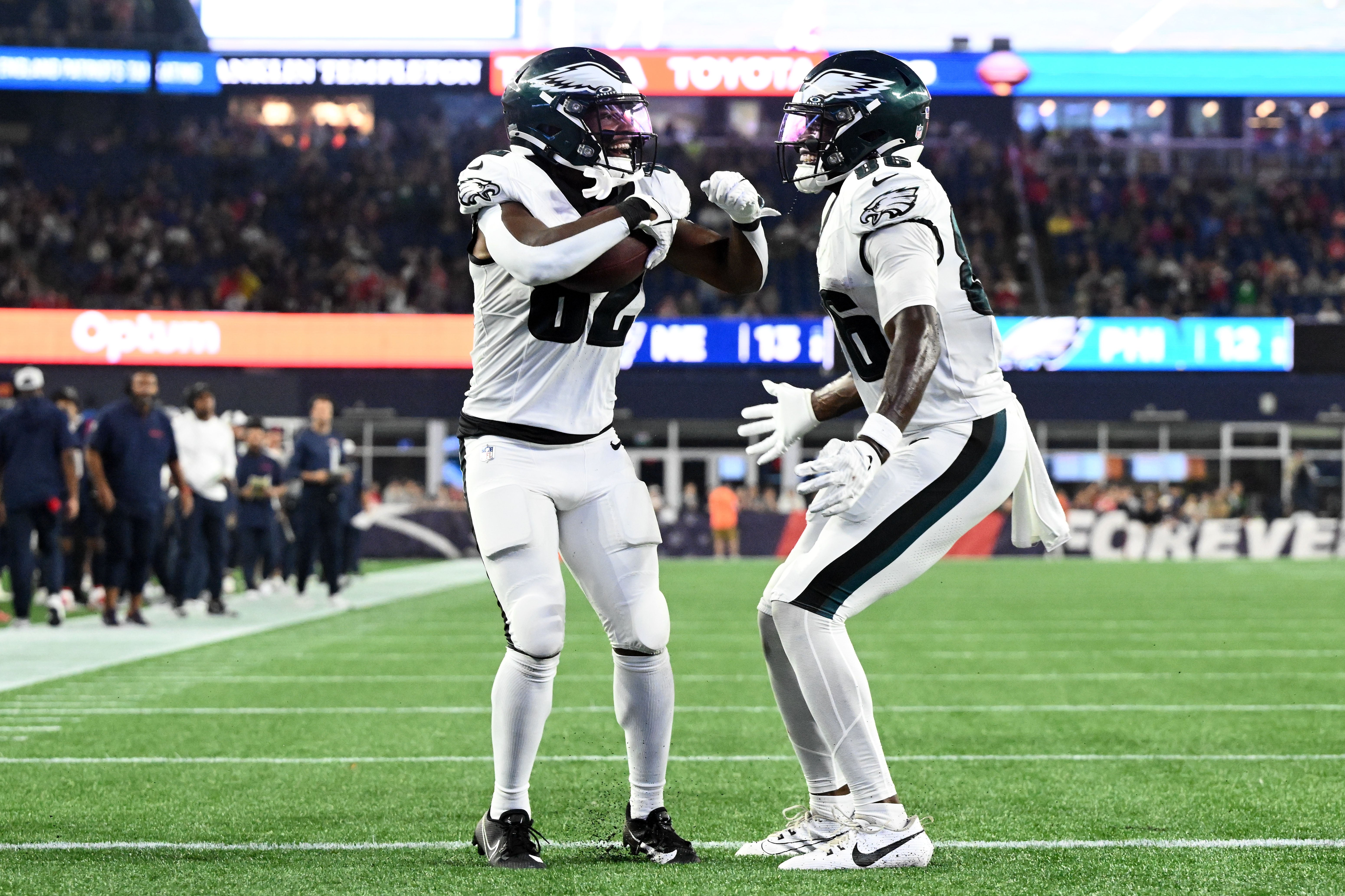 Philadelphia Eagles wide receiver Ainias Smith (82) celebrates with wide receiver Joseph Ngata (86) after scoring an extra point against the New England Patriots during the second half at Gillette Stadium.